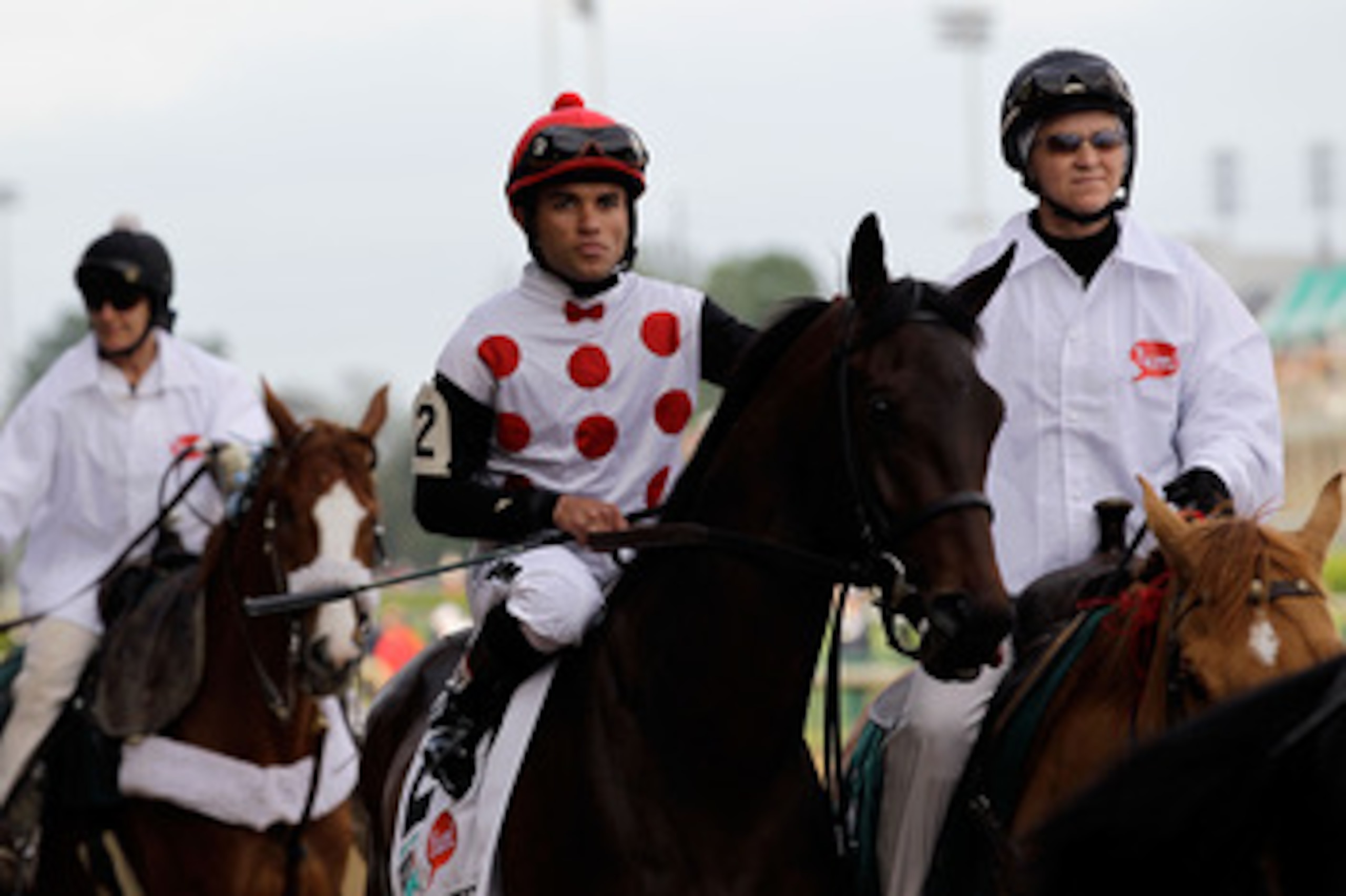 LOUISVILLE, KY - MAY 07:  Jockey Joel Rosario, riding Brilliant Speed #2, is escourted onto the track by an outrider for the running of the 137th Kentucky Derby at Churchill Downs on May 7, 2011 in Louisville, Kentucky.  (Photo by Rob Carr/Getty Images)