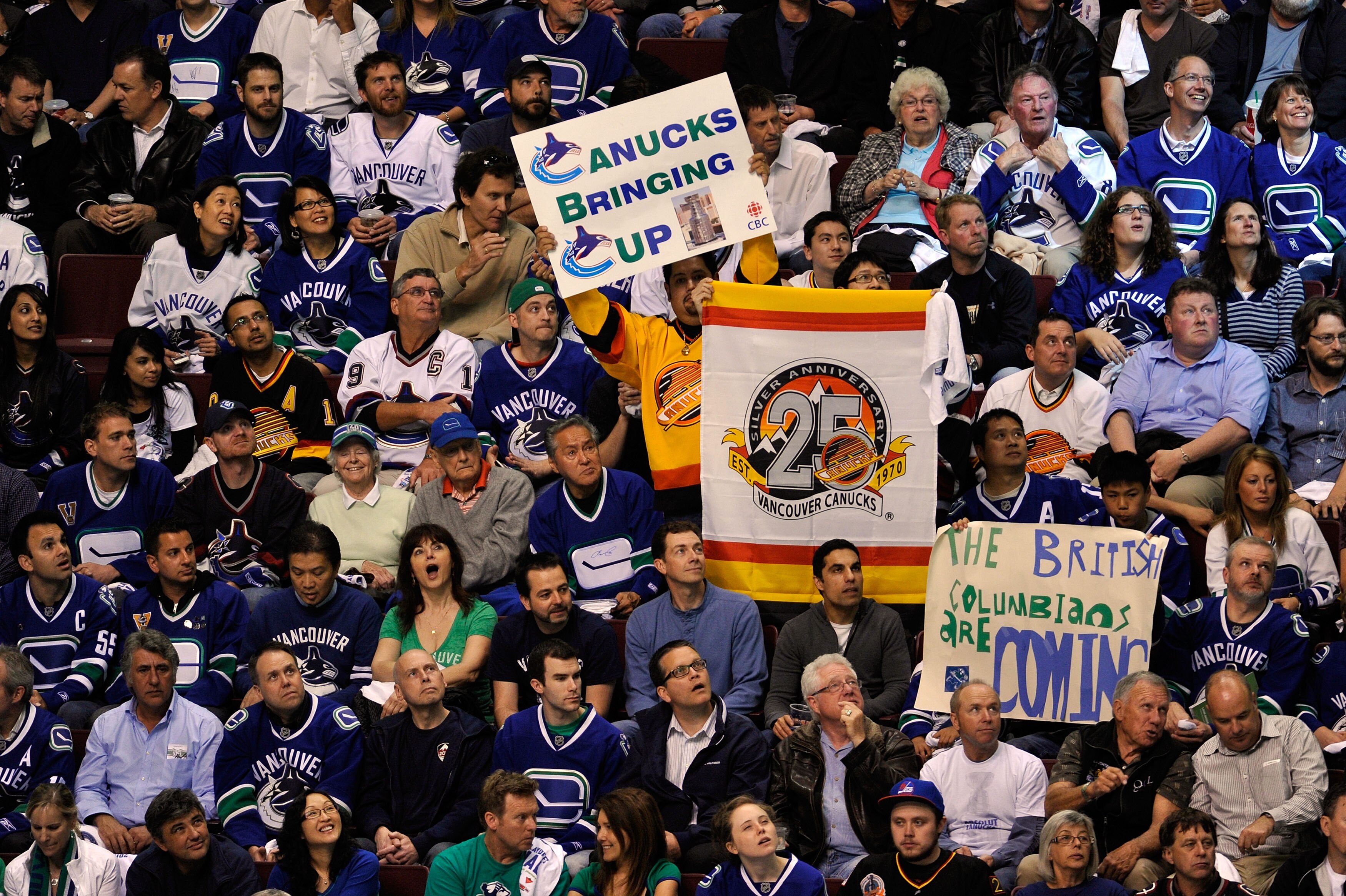 VANCOUVER, BC - JUNE 01:  Fans of the  Vancouver Canucks cheer during game one against the Boston Bruins in the 2011 NHL Stanley Cup Finals at Rogers Arena on June 1, 2011 in Vancouver, Canada.  (Photo by Rich Lam/Getty Images)