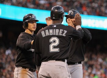 SAN FRANCISCO, CA - MAY 24:  (from left) Chris Coghlan #8, Hanley Ramirez #2 and Logan Morrison #20 of the Florida Marlins celebrate after they all scored on a double by Gaby Sanchez #15 of the Florida Marlins in the third inning against the San Francisco
