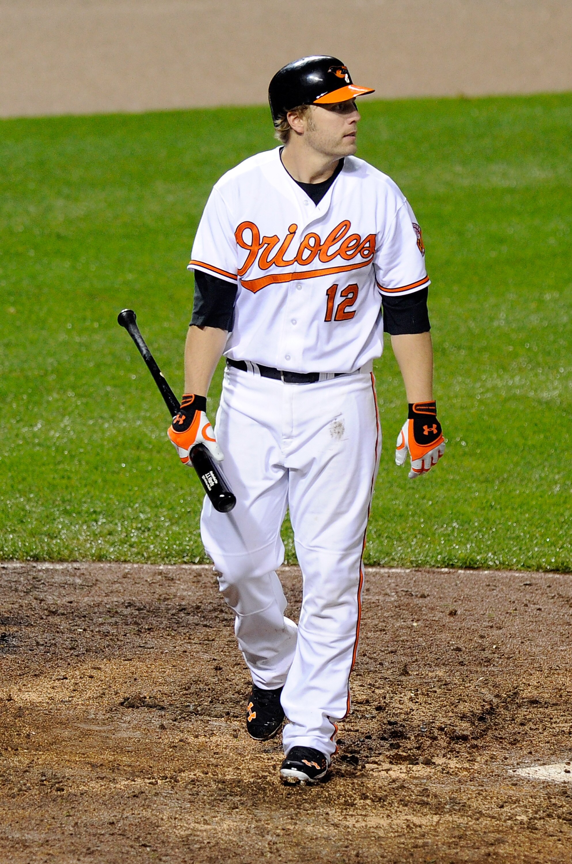 BALTIMORE, MD - MAY 19:  Mark Reynolds #12 of the Baltimore Orioles walks to the dugout after striking out against the New York Yankees at Oriole Park at Camden Yards on May 19, 2011 in Baltimore, Maryland.  (Photo by Greg Fiume/Getty Images)
