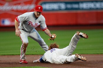 NEW YORK, NY - MAY 28: Justin Turner #2 of the New York Mets steals second base in front of Chase Utley #26 of the Philadelphia Phillies at Citi Field on May 28, 2011 in the Flushing neighborhood of the Queens borough of New York City.  (Photo by Chris Tr