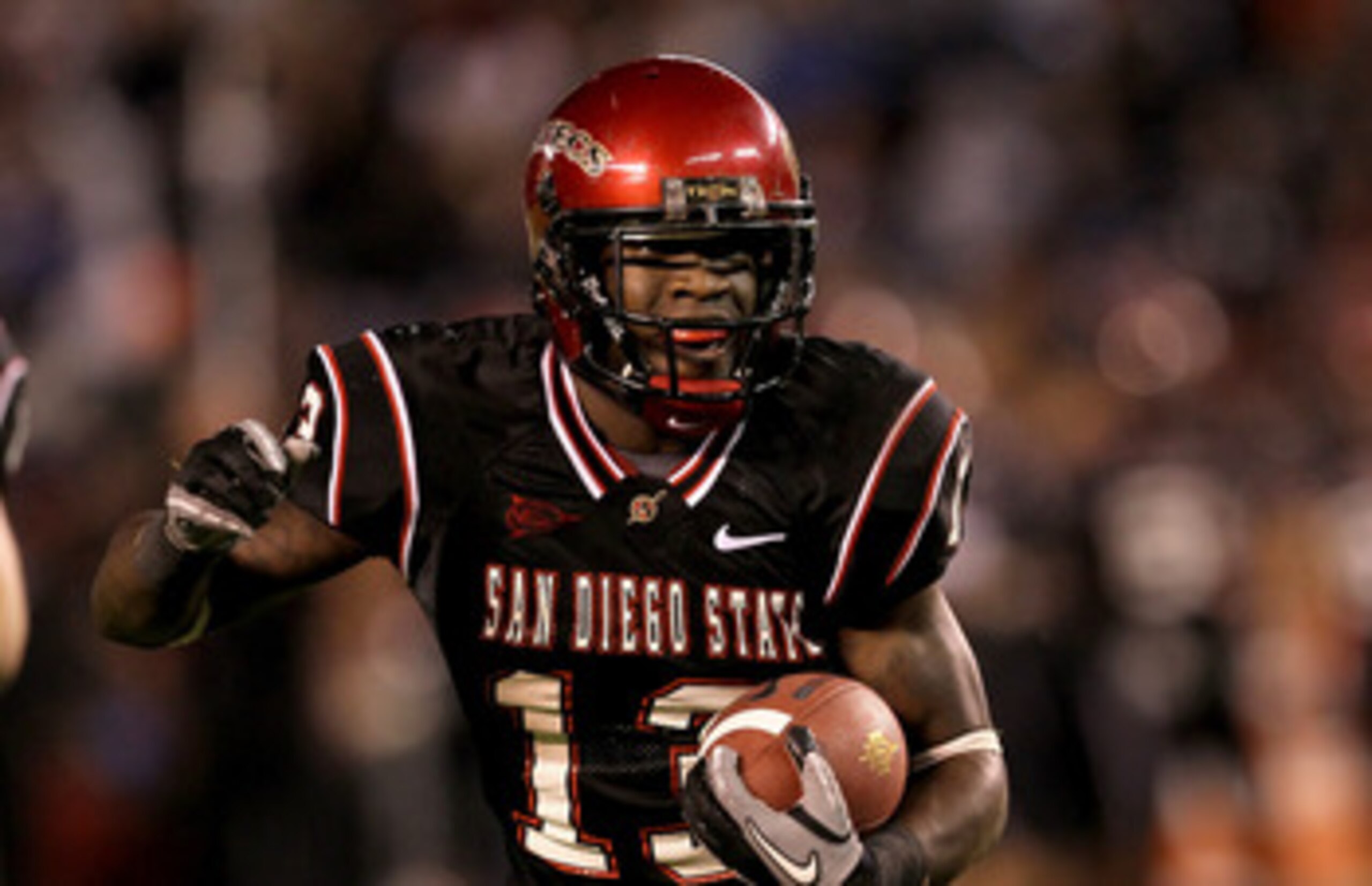 SAN DIEGO - NOVEMBER 20:  Running back Ronnie Hillman #13 of the San Deigo State Aztecs carries the ball on a five yard touchdown run in the second quarter against the Utah Utes at Qualcomm Stadium on November 20, 2010 in San Diego, California.  (Photo by