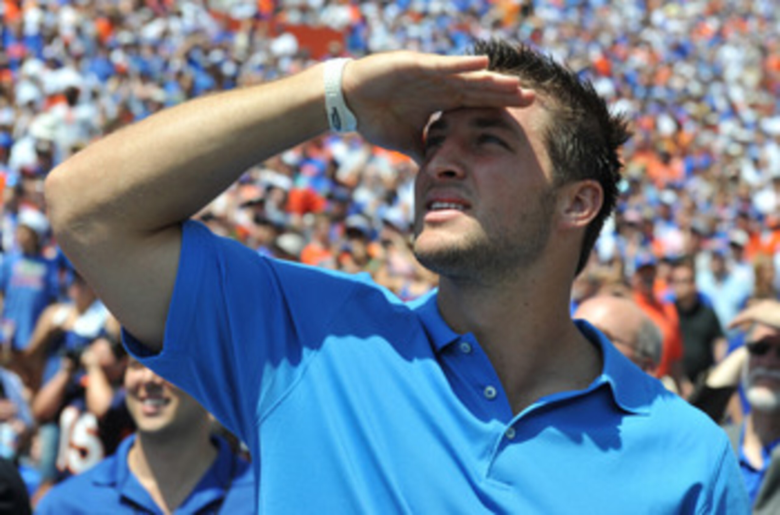 GAINESVILLE, FL - APRIL 9:  Tim Tebow watches a scoreboard as life-size statues of the Florida Gators three Heisman trophy winners are unvelied at halftime of the Orange and Blue spring football game April 9, 2011 Ben Hill Griffin Stadium at Gainesville,