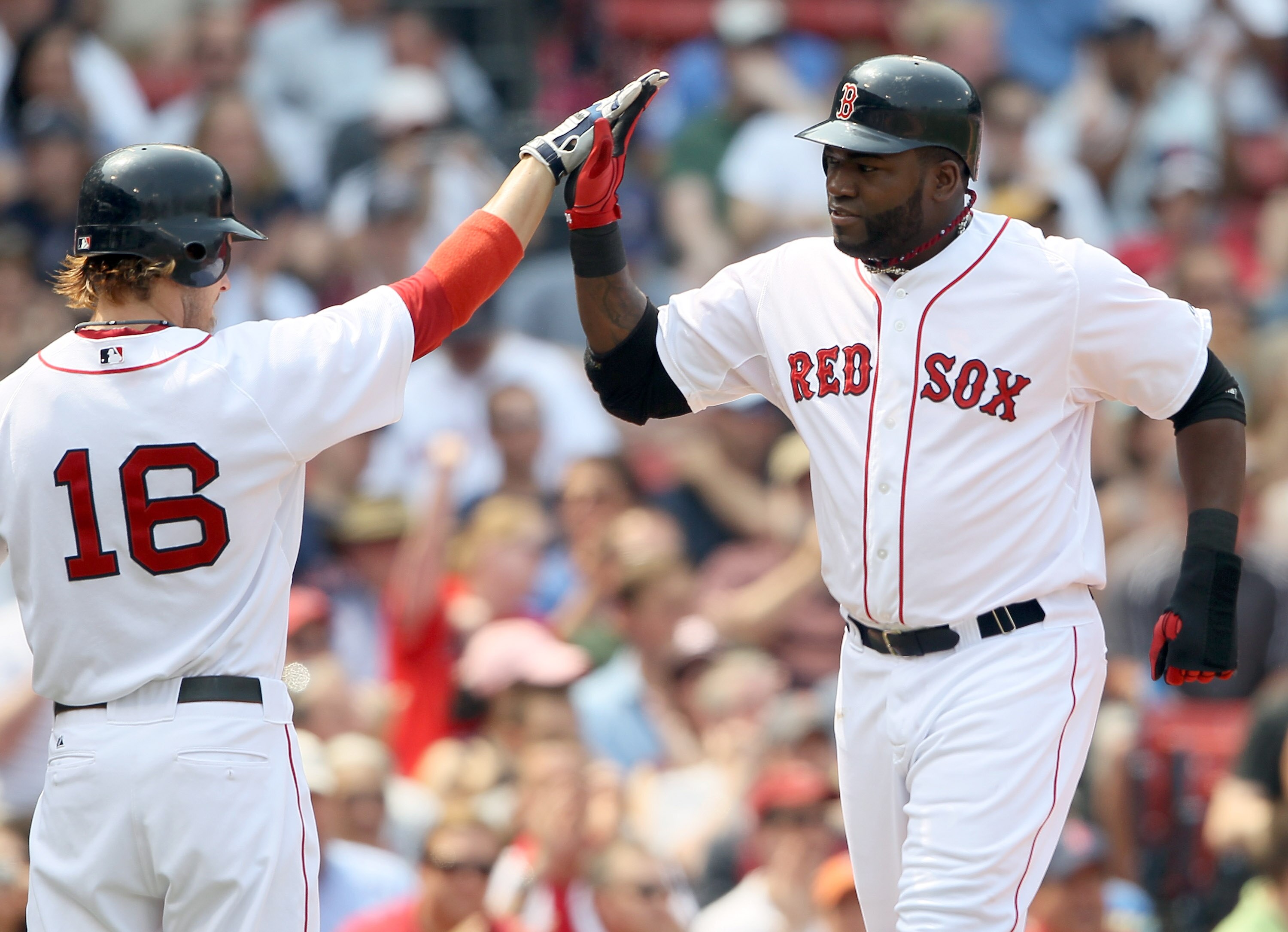 BOSTON, MA - JUNE 01:  David Ortiz #34 of the Boston Red Sox is congratulated by teammate Josh Reddick #16 after Ortiz scored in the second inning against the Chicago White Sox on June 1, 2011 at Fenway Park in Boston, Massachusetts.  (Photo by Elsa/Getty