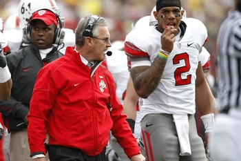 ANN ARBOR, MI - NOVEMBER 21: Head coach Jim Tressel of the Ohio State Buckeyes walks the sideline next to Terrelle Pryor #2 while playing the Michigan Wolverines on November 21, 2009 at Michigan Stadium in Ann Arbor, Michigan. Ohio State won the game 21-1