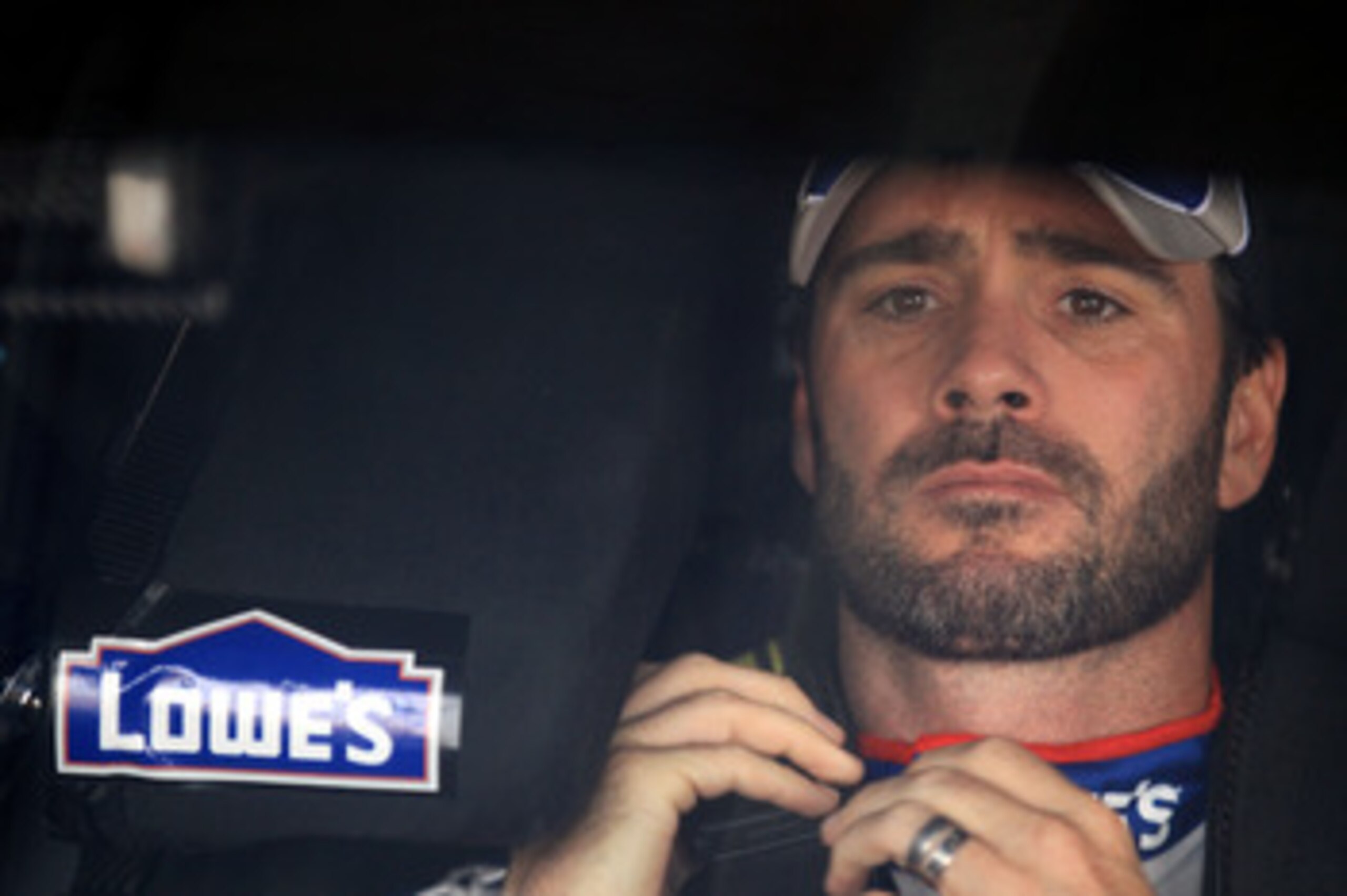 CHARLOTTE, NC - MAY 28:  Jimmie Johnson, driver of the #48 Lowe's Summer Salute Chevrolet, sits in his car during practice for the NASCAR Sprint Cup Series Coca-Cola 600 at Charlotte Motor Speedway on May 28, 2011 in Charlotte, North Carolina.  (Photo by 