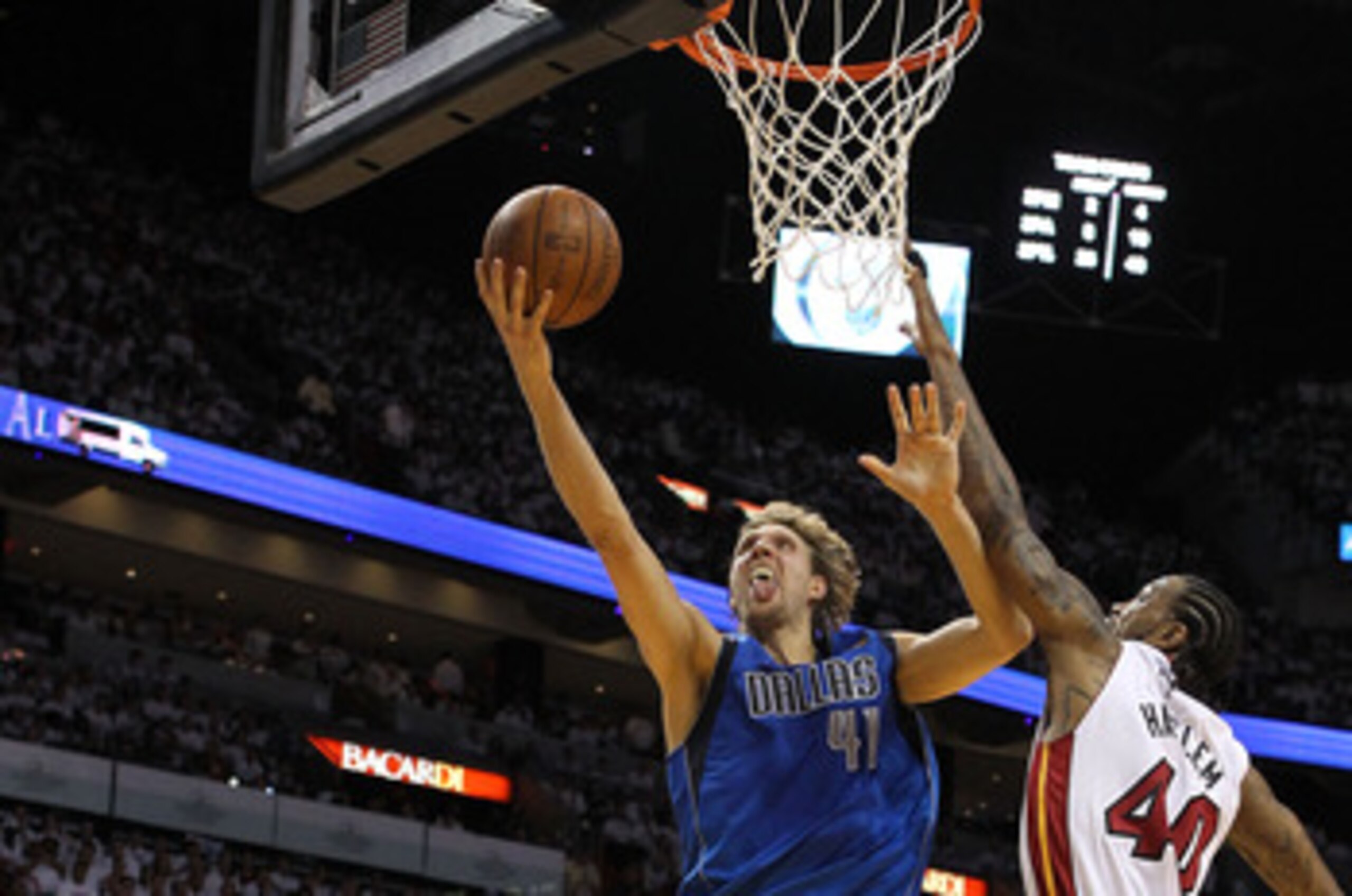 MIAMI, FL - MAY 31:  Dirk Nowitzki #41 of the Dallas Mavericks goes up for a layup against Udonis Haslem #40 of the Miami Heat in the first half in Game One of the 2011 NBA Finals at American Airlines Arena on May 31, 2011 in Miami, Florida. NOTE TO USER: