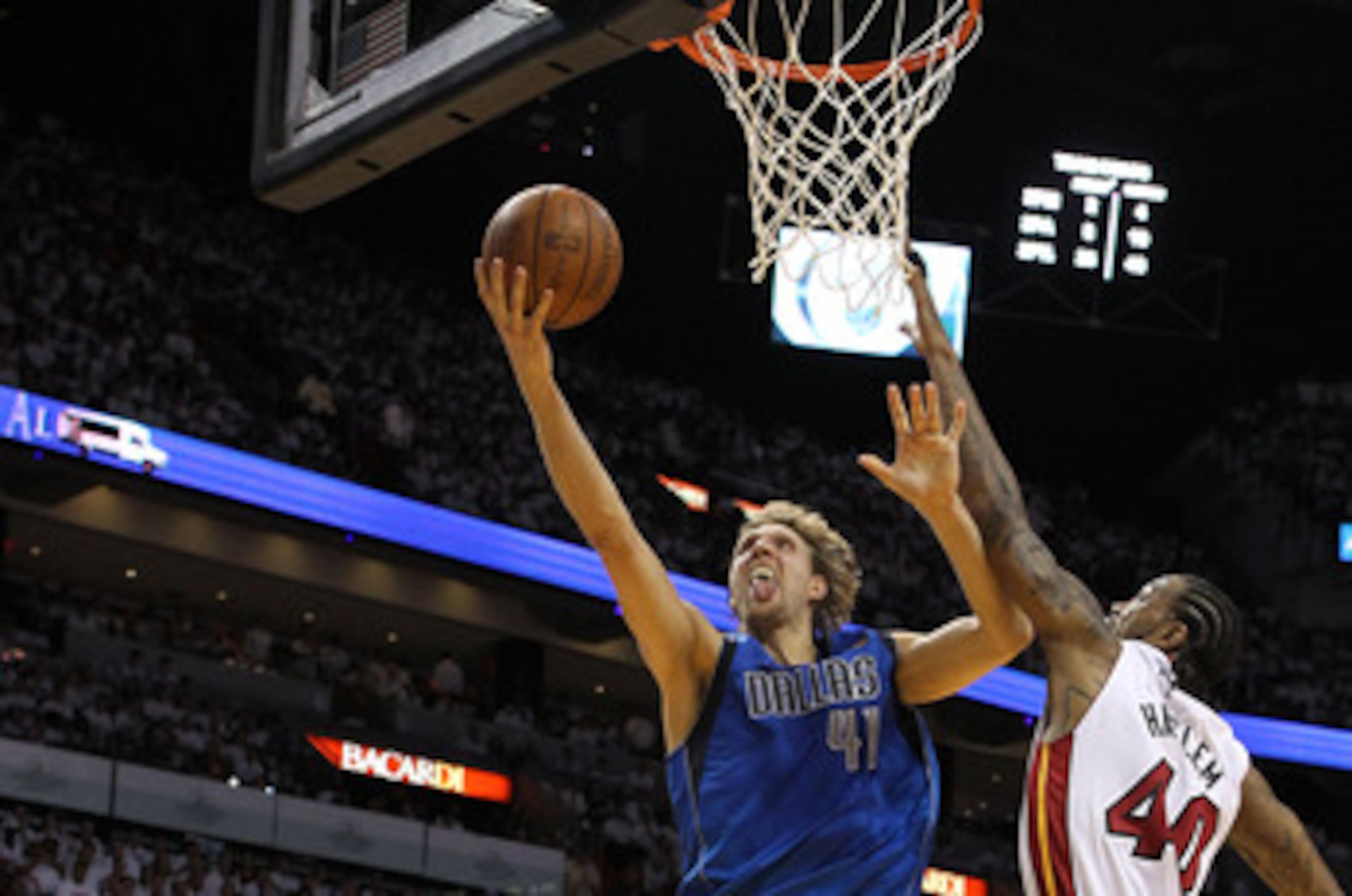 MIAMI, FL - MAY 31:  Dirk Nowitzki #41 of the Dallas Mavericks goes up for a layup against Udonis Haslem #40 of the Miami Heat in the first half in Game One of the 2011 NBA Finals at American Airlines Arena on May 31, 2011 in Miami, Florida. NOTE TO USER: