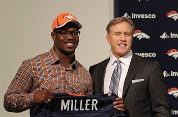 ENGLEWOOD, CO - APRIL 29: Von Miller of the Denver Broncos is presented to the media for the first time with vice president of football operations John Elway at Dove Valley on April 29, 2011 in Englewood, Colorado. Miller, a projected outside linebacker ENGLEWOOD, CO - APRIL 29: Von Miller of the Denver Broncos is presented to the media for the first time with vice president of football operations John Elway at Dove Valley on April 29, 2011 in Englewood, Colorado. Miller, a projected outside linebacker