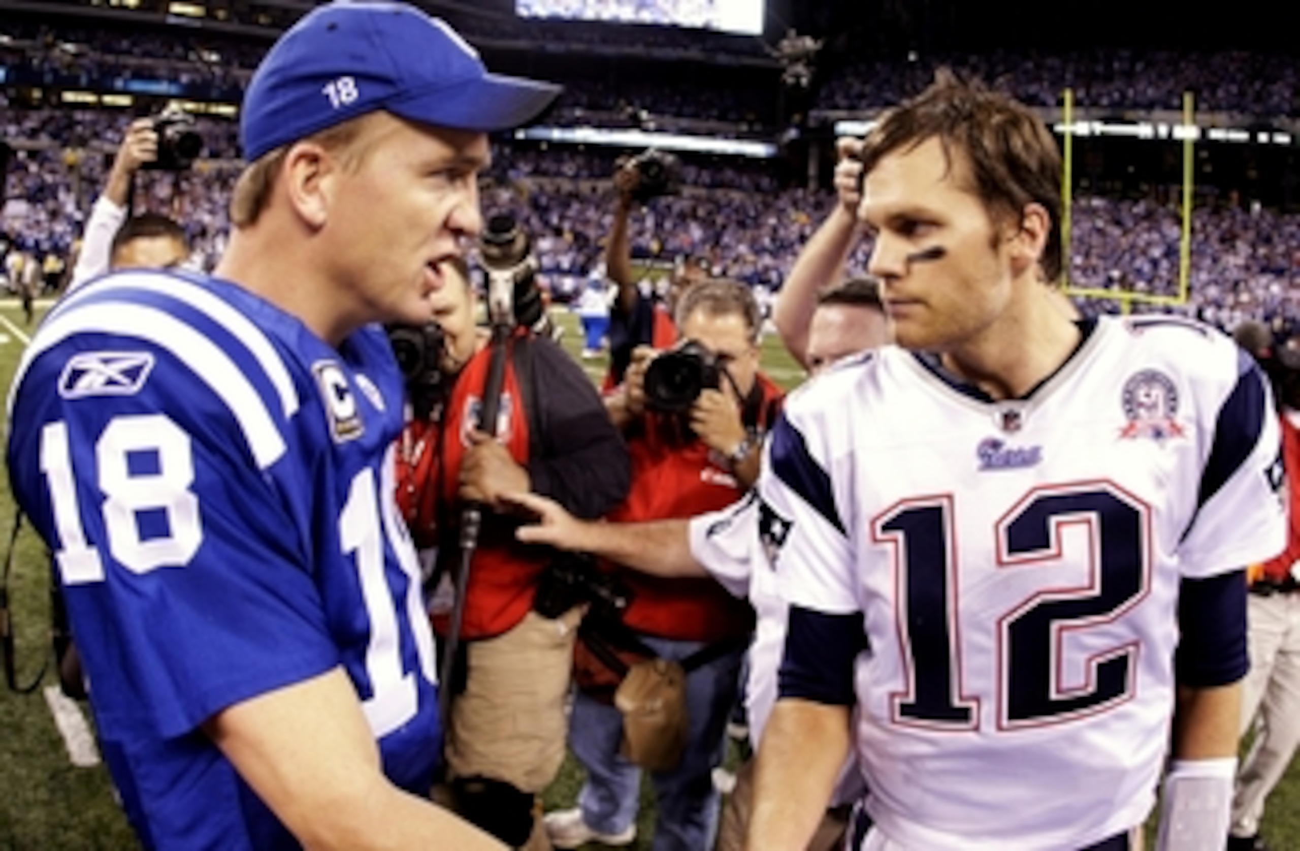 INDIANAPOLIS - NOVEMBER 15:  Quarterback Peyton Manning #18 of the Indianapolis Colts greets Tom Brady #12 of the New England Patriots after the game at Lucas Oil Stadium on November 15, 2009 in Indianapolis, Indiana.  The Colts won the game 35-34.  (Phot