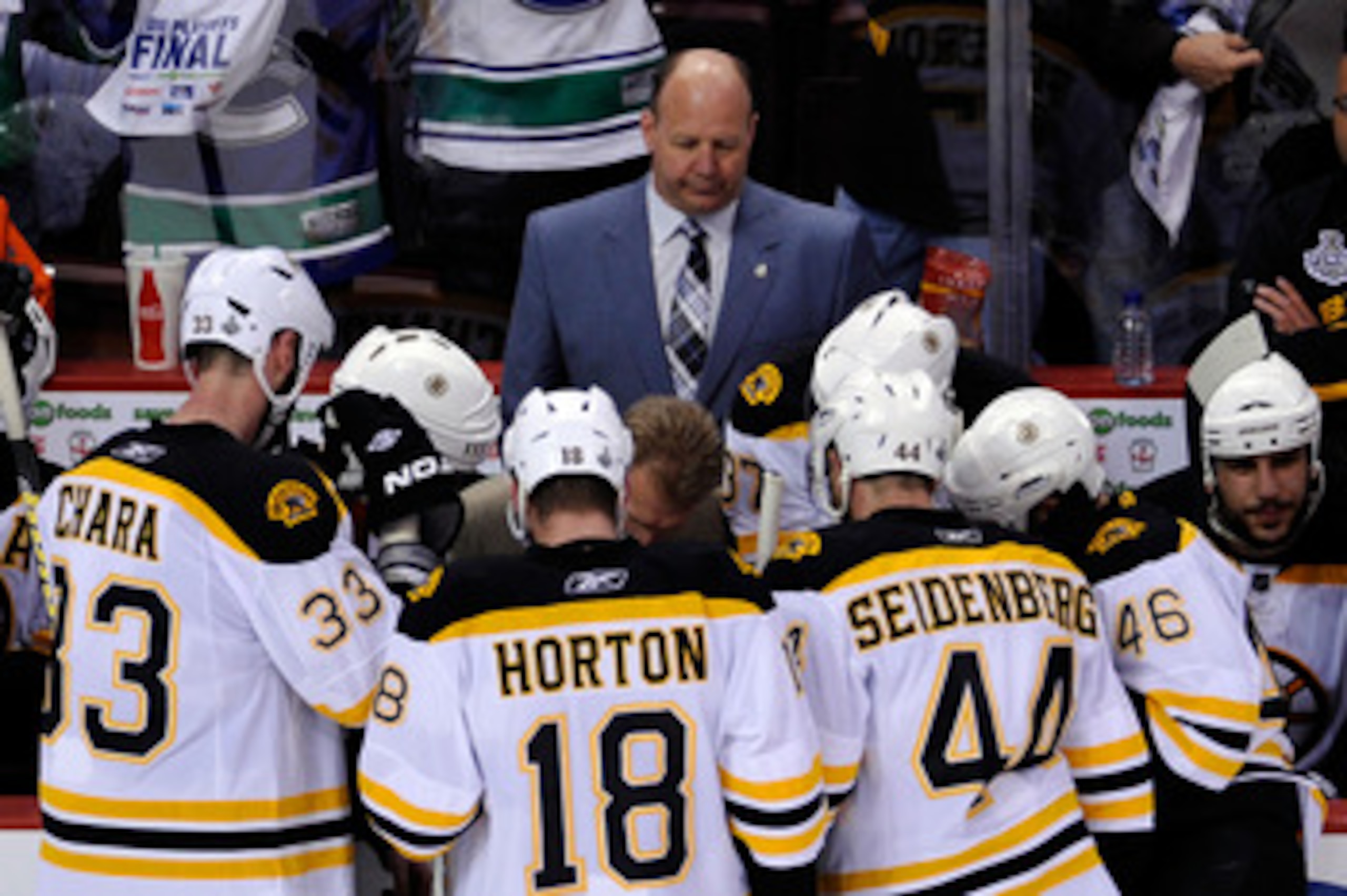 VANCOUVER, BC - JUNE 01:  Head Coach Claude Julien (C) of the Boston Bruins speaks to the player on the bench after a play against the Vancouver Canucks in game one of the 2011 NHL Stanley Cup Finals at Rogers Arena on June 1, 2011 in Vancouver, Canada.