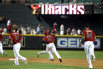 PHOENIX, AZ - JUNE 01:  Justin Upton #10 of the Arizona Diamondbacks celebrates with teammates Ryan Robberts #14 and Chris Young #24 after his game winning RBI single against the Florida Marlins in ninth inning of the Major League Baseball game at Chase F