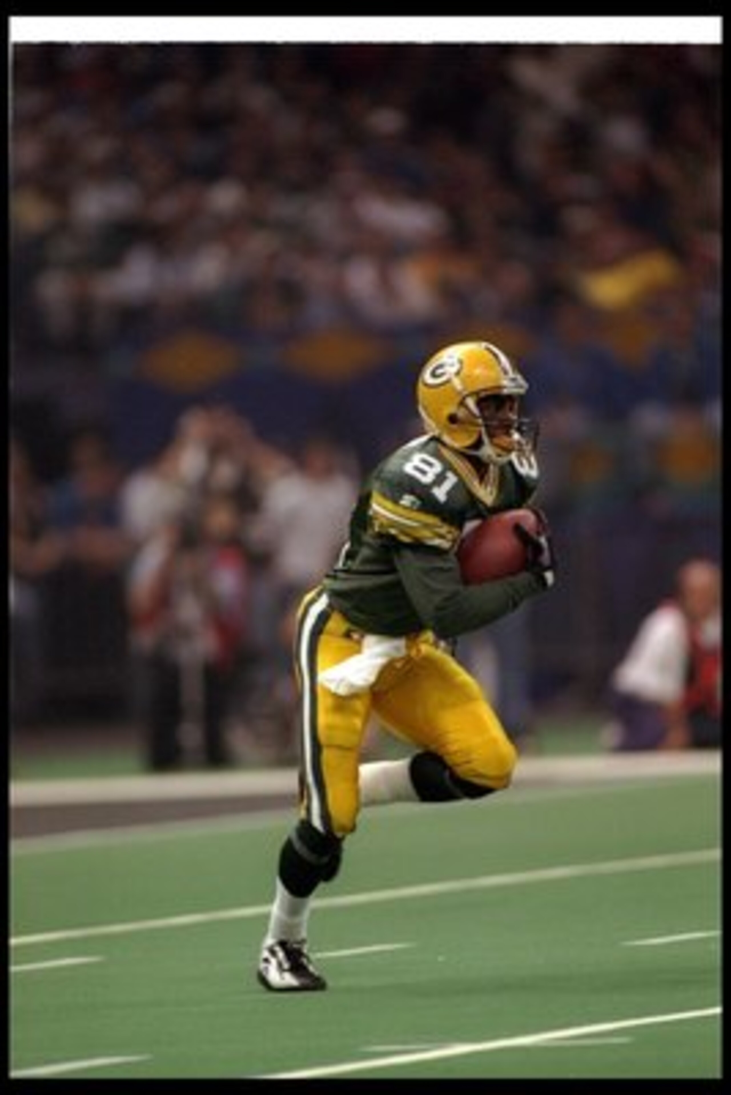 26 Jan 1997:  Wide receiver Desmond Howard of the Green Bay Packers moves the ball during Super Bowl XXXI against the New England Patriots at the Superdome in New Orleans, Louisiana.  The Packers won the game, 35-21. Mandatory Credit: Rick Stewart  /Allsp