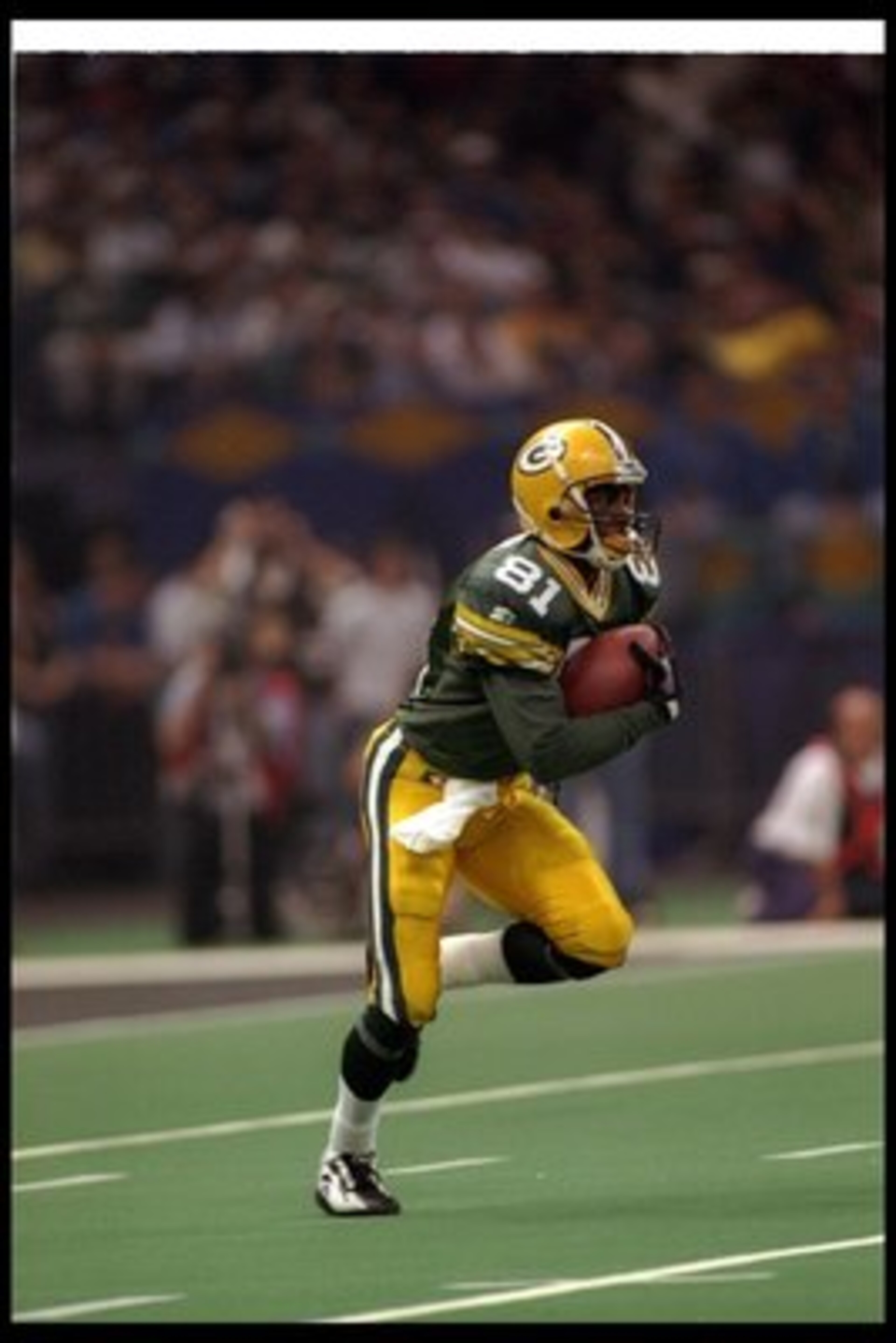26 Jan 1997:  Wide receiver Desmond Howard of the Green Bay Packers moves the ball during Super Bowl XXXI against the New England Patriots at the Superdome in New Orleans, Louisiana.  The Packers won the game, 35-21. Mandatory Credit: Rick Stewart  /Allsp