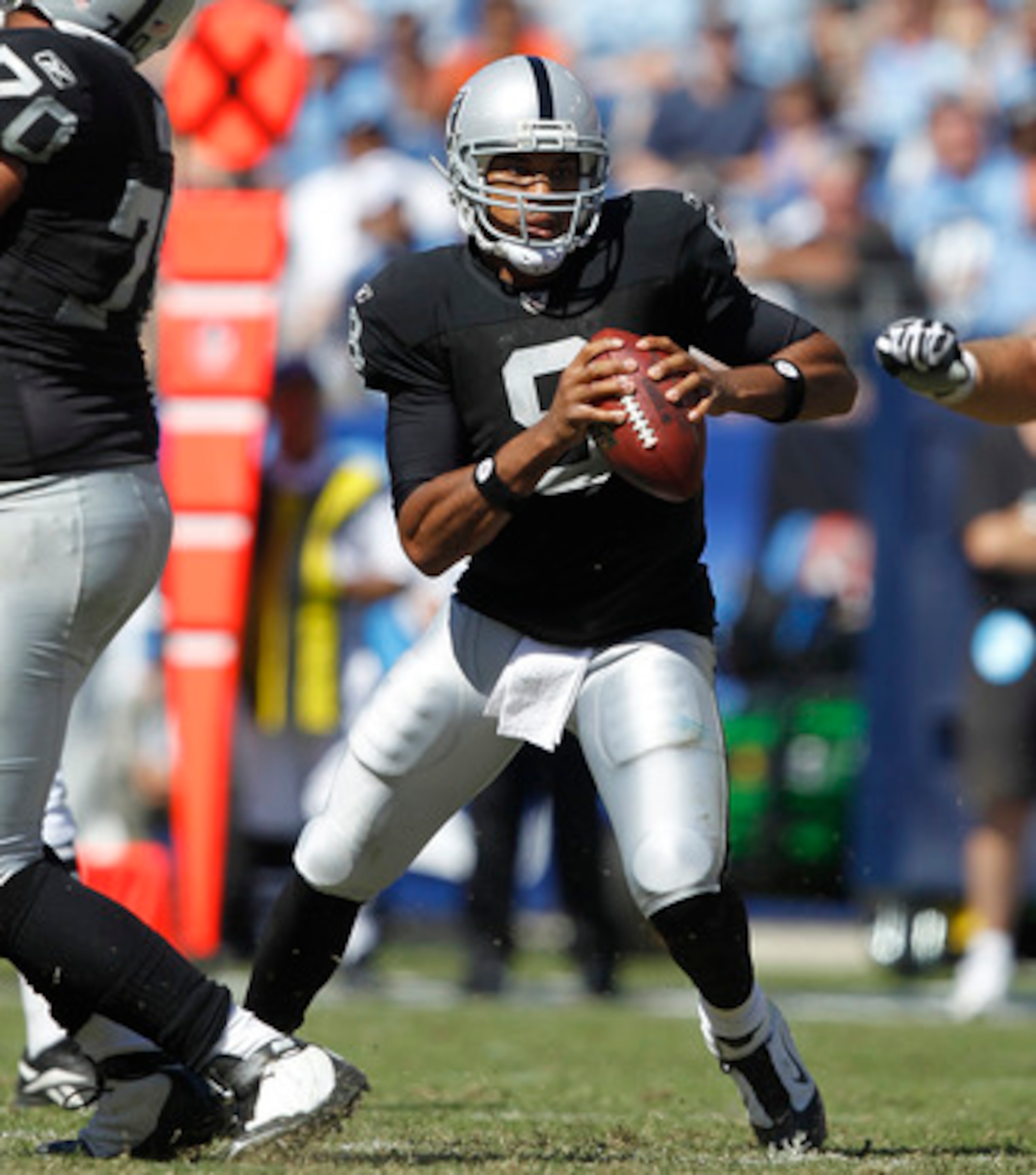 NASHVILLE - SEPTEMBER 12: Jason Campbell #8 of the Oakland Raiders looks to pass against the Tennessee Titans during the NFL season opener at LP Field on September 12, 2010 in Nashville, Tennessee. The Titans defeated the Raiders 38-13. (Photo by Joe Robb