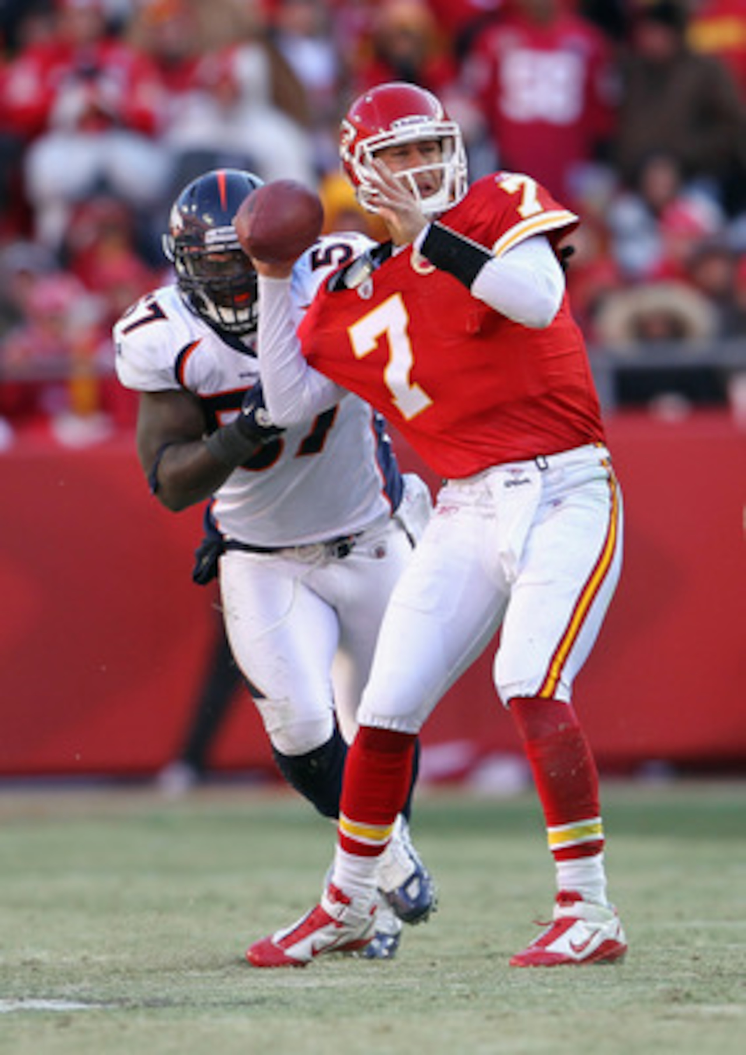KANSAS CITY, MO - DECEMBER 05:  Quarterback Matt Cassel #7 of the Kansas City Chiefs is pressured by Mario Haggan #57 of the Denver Broncos during the game on December 5, 2010 at Arrowhead Stadium in Kansas City, Missouri.  (Photo by Jamie Squire/Getty Im