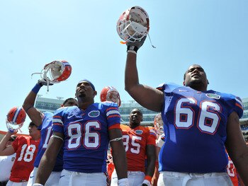 GAINESVILLE, FL - APRIL 9:  Tight end Josh Postell #86 and guard James Wilson #66 of the Florida Gators celebrate after the Orange and Blue spring football game April 9, 2011 Ben Hill Griffin Stadium at Gainesville, Florida.  (Photo by Al Messerschmidt/Ge