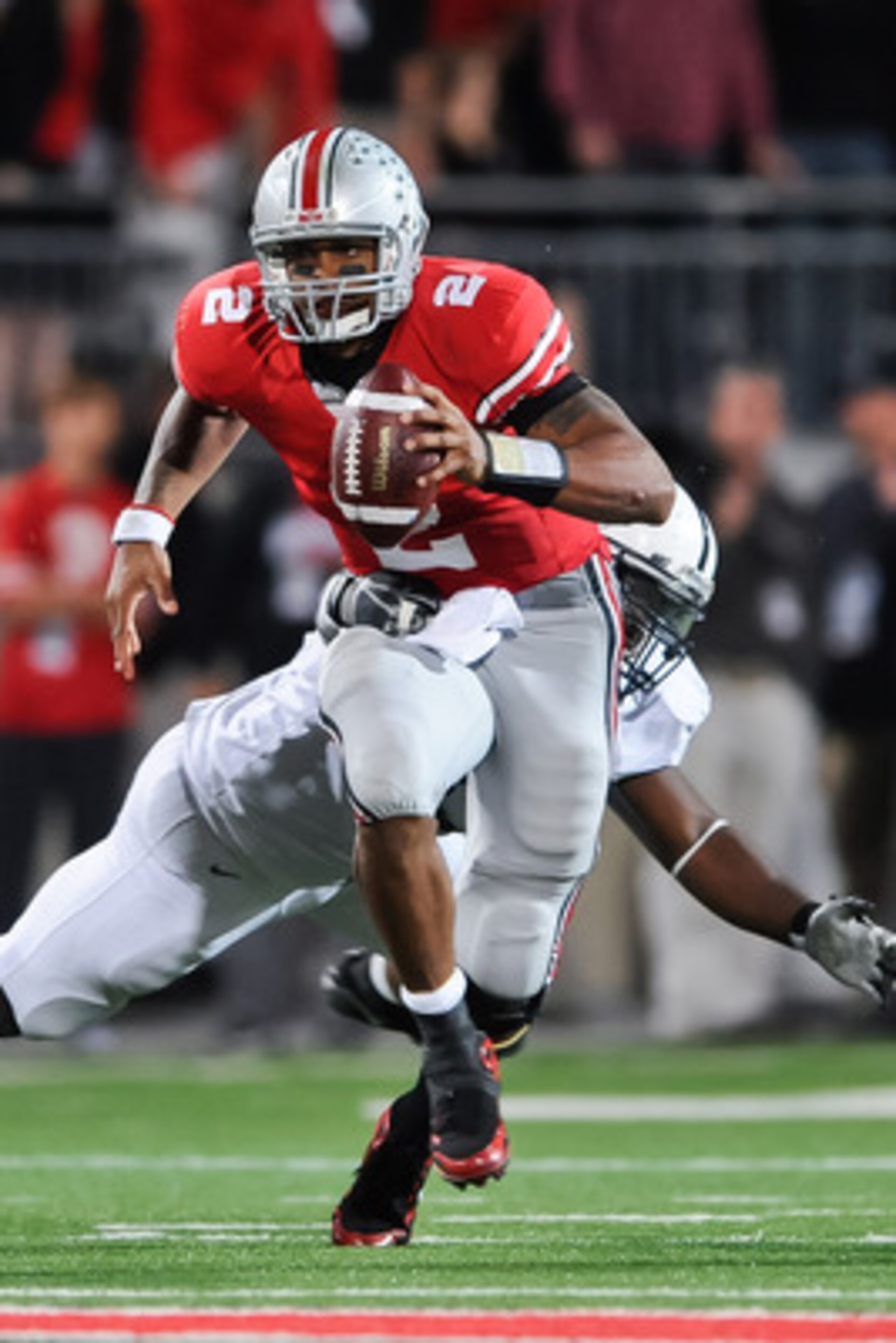 COLUMBUS, OH - NOVEMBER 13:  Quarterback Terrelle Pryor #2 of the Ohio State Buckeyes runs with the ball against the Penn State Nittany Lions at Ohio Stadium on November 13, 2010 in Columbus, Ohio.  (Photo by Jamie Sabau/Getty Images)