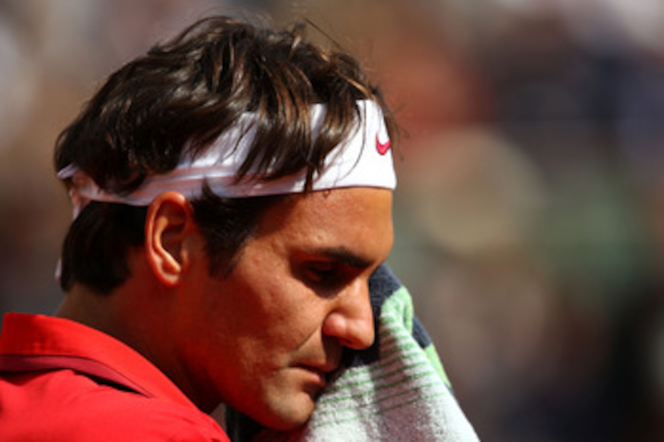 PARIS, FRANCE - MAY 31:  Roger Federer of Switzerland reacts during the men's singles quarterfinal match between Gael Monfils of France and Roger Federer of Switzerland on day ten of the French Open at Roland Garros on May 31, 2011 in Paris, France.  (Pho