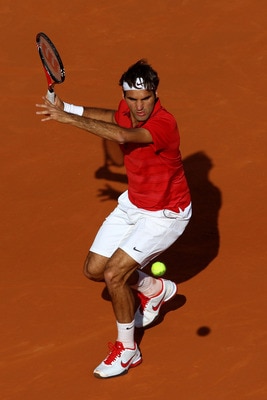 PARIS, FRANCE - MAY 31:  Roger Federer of Switzerland hits a forehand during the men's singles quarterfinal match between Gael Monfils of France and Roger Federer of Switzerland on day ten of the French Open at Roland Garros on May 31, 2011 in Paris, Fran
