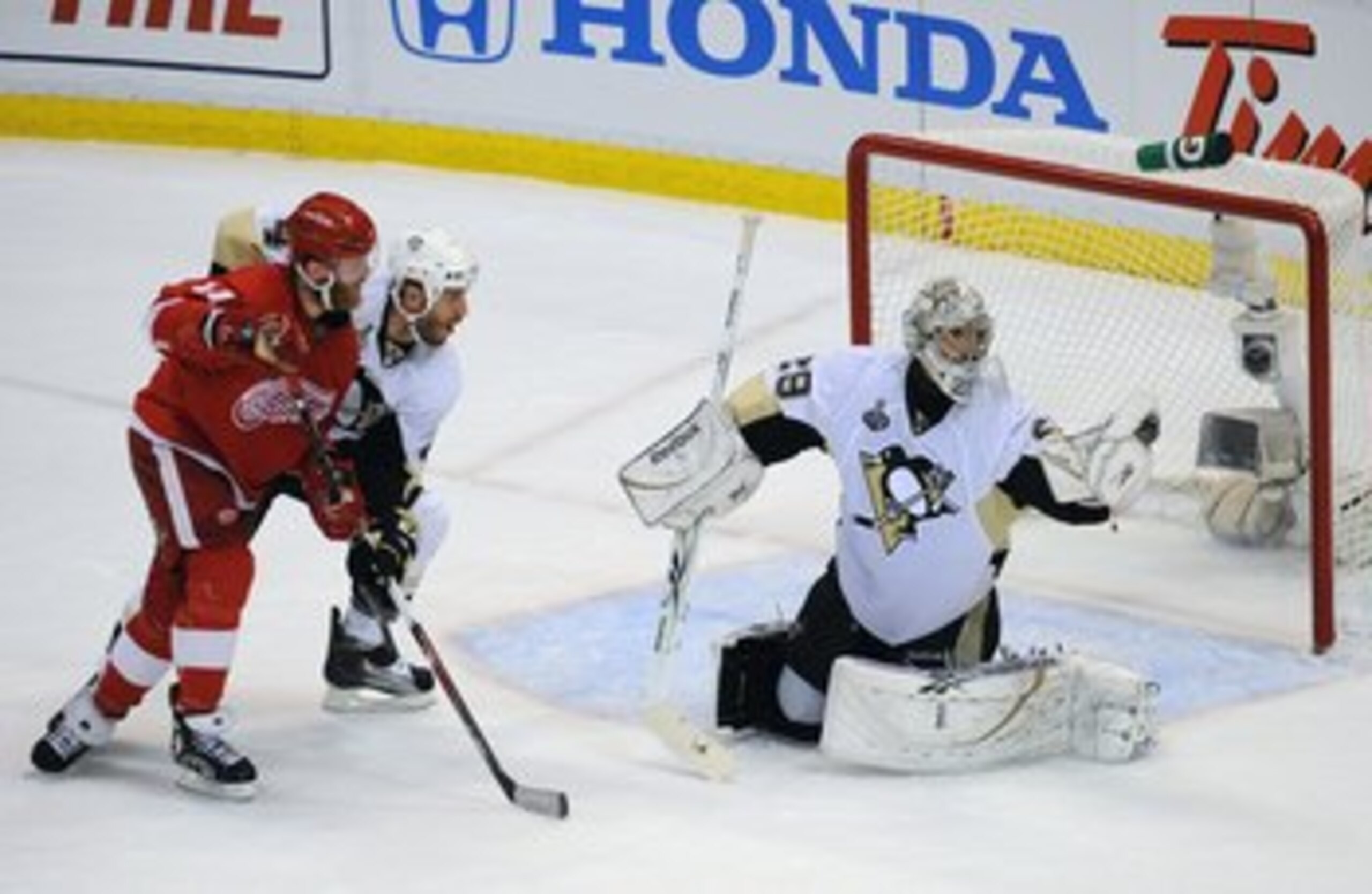 DETROIT - JUNE 12:  Goaltender Marc-Andre Fleury #29 of the Pittsburgh Penguins makes a glove save against the Detroit Red Wings during Game Seven of the 2009 NHL Stanley Cup Finals at Joe Louis Arena on June 12, 2009 in Detroit, Michigan. The Penguins de