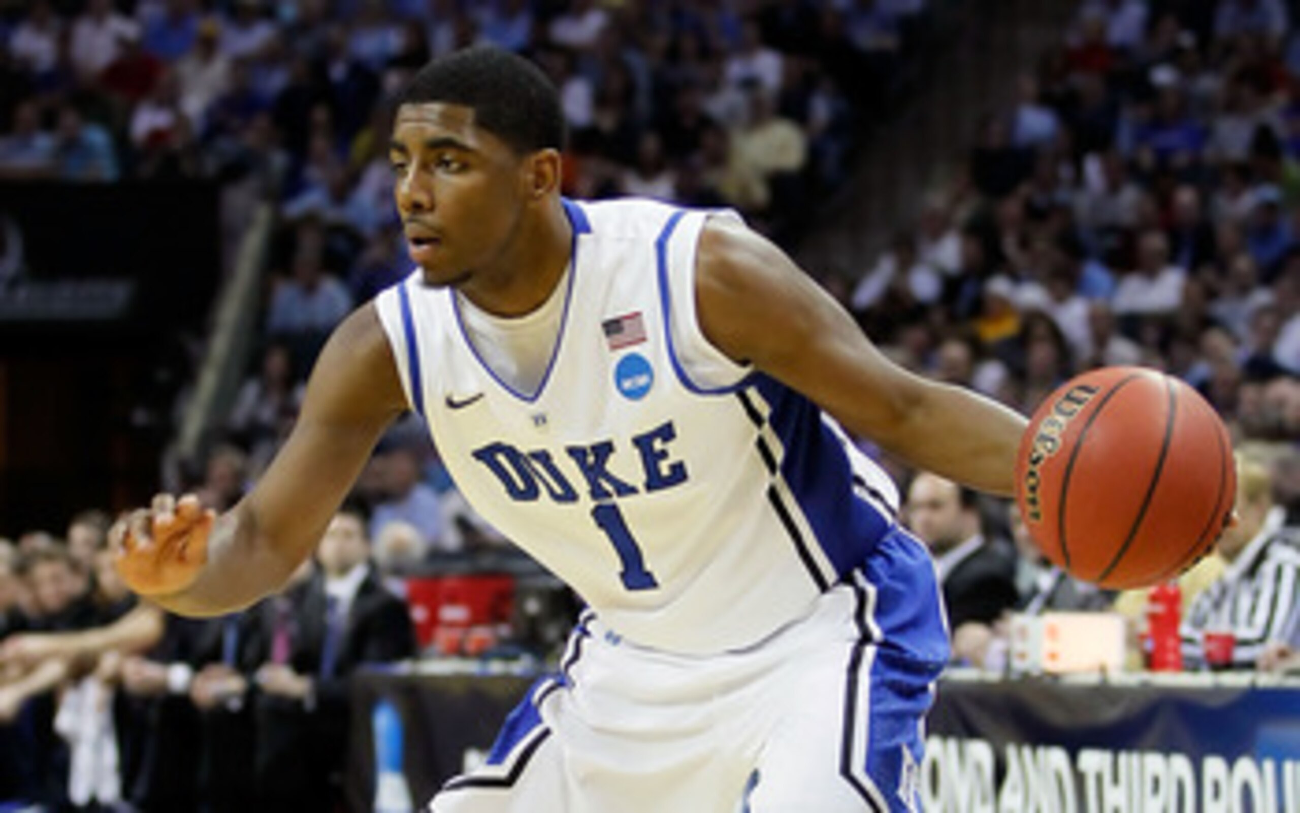 CHARLOTTE, NC - MARCH 20: Kyrie Irving #1 of the Duke Blue Devils moves the ball while taking on the Michigan Wolverines during the third round of the 2011 NCAA men's basketball tournament at Time Warner Cable Arena on March 20, 2011 in Charlotte, North CHARLOTTE, NC - MARCH 20: Kyrie Irving #1 of the Duke Blue Devils moves the ball while taking on the Michigan Wolverines during the third round of the 2011 NCAA men's basketball tournament at Time Warner Cable Arena on March 20, 2011 in Charlotte, North