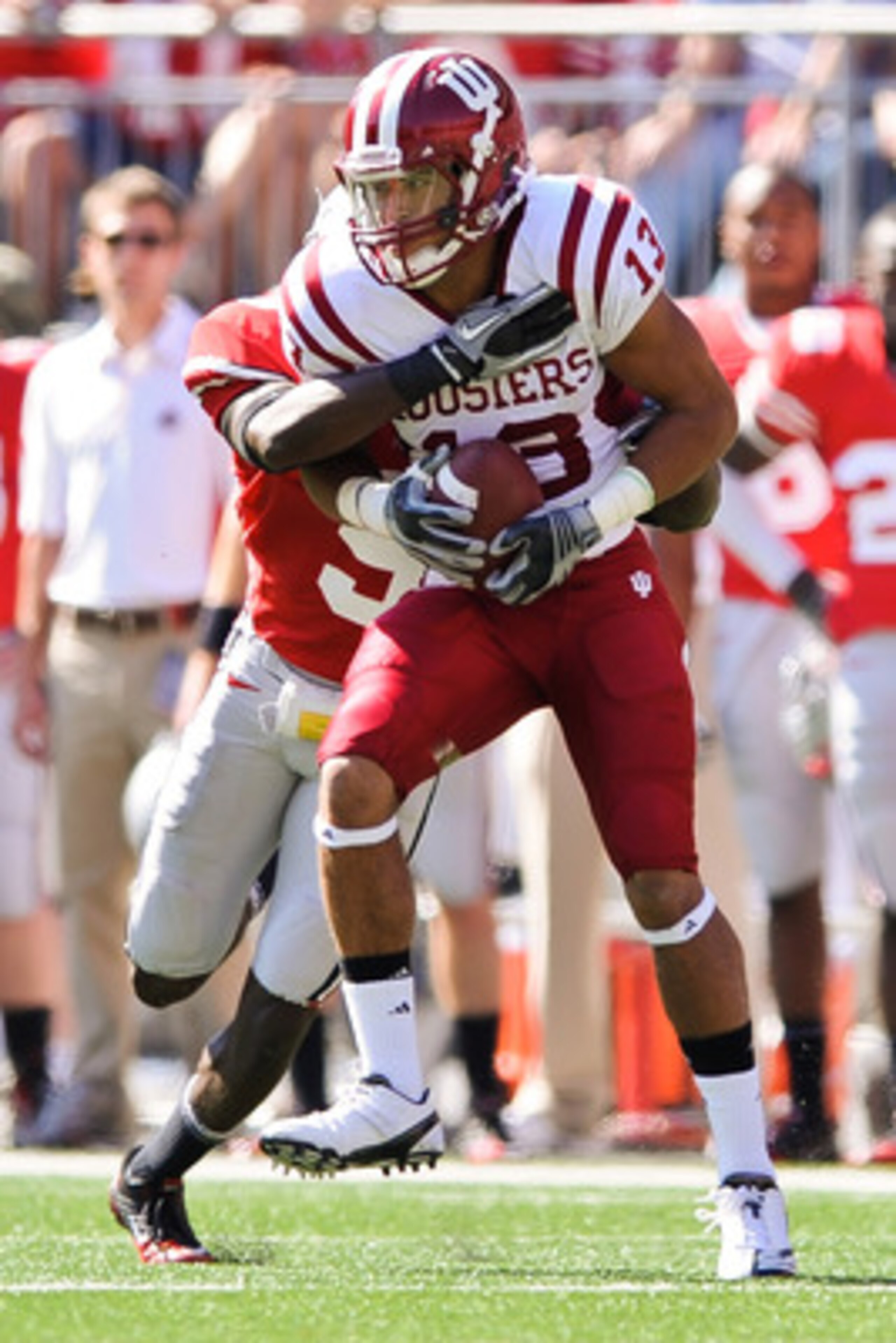 COLUMBUS, OH - OCTOBER 9:  Kofi Hughes #13 of the Indiana Hoosiers runs with the ball after making a catch against the Ohio State Buckeyes at Ohio Stadium on October 9, 2010 in Columbus, Ohio.  (Photo by Jamie Sabau/Getty Images)