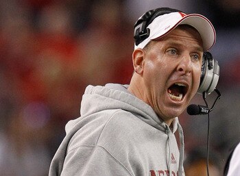 ARLINGTON, TX - DECEMBER 04:  Head coach Bo Pelini of the Nebraska Cornhuskers leads his team against the Oklahoma Sooners at Cowboys Stadium on December 4, 2010 in Arlington, Texas. The Sooners beat the Cornhuskers 23-20.  (Photo by Tom Pennington/Getty