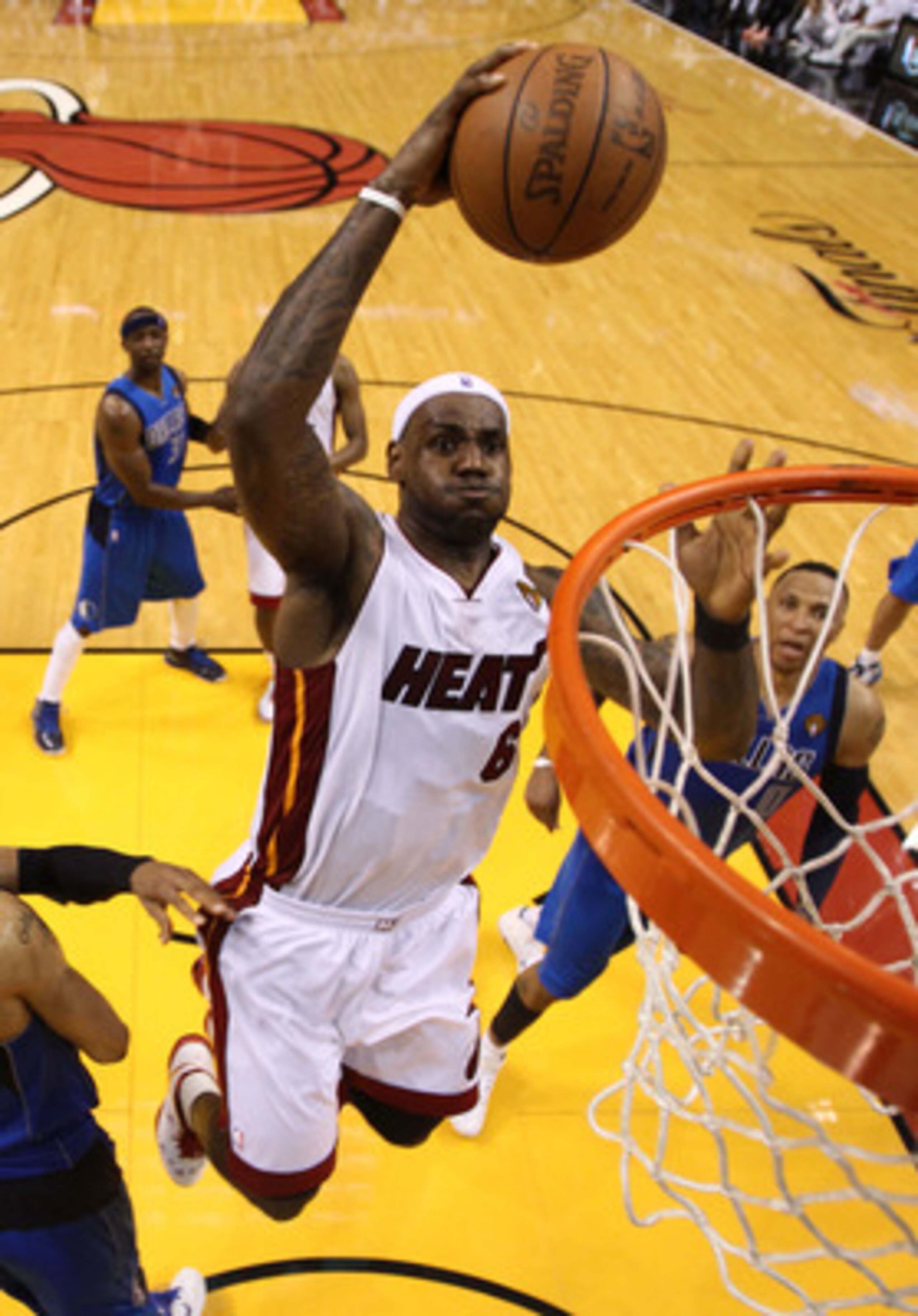 MIAMI, FL - MAY 31:  LeBron James #6 of the Miami Heat dunks the ball over Tyson Chandler #6 of the Dallas Mavericks in the fourth quarter in Game One of the 2011 NBA Finals at American Airlines Arena on May 31, 2011 in Miami, Florida. NOTE TO USER: User