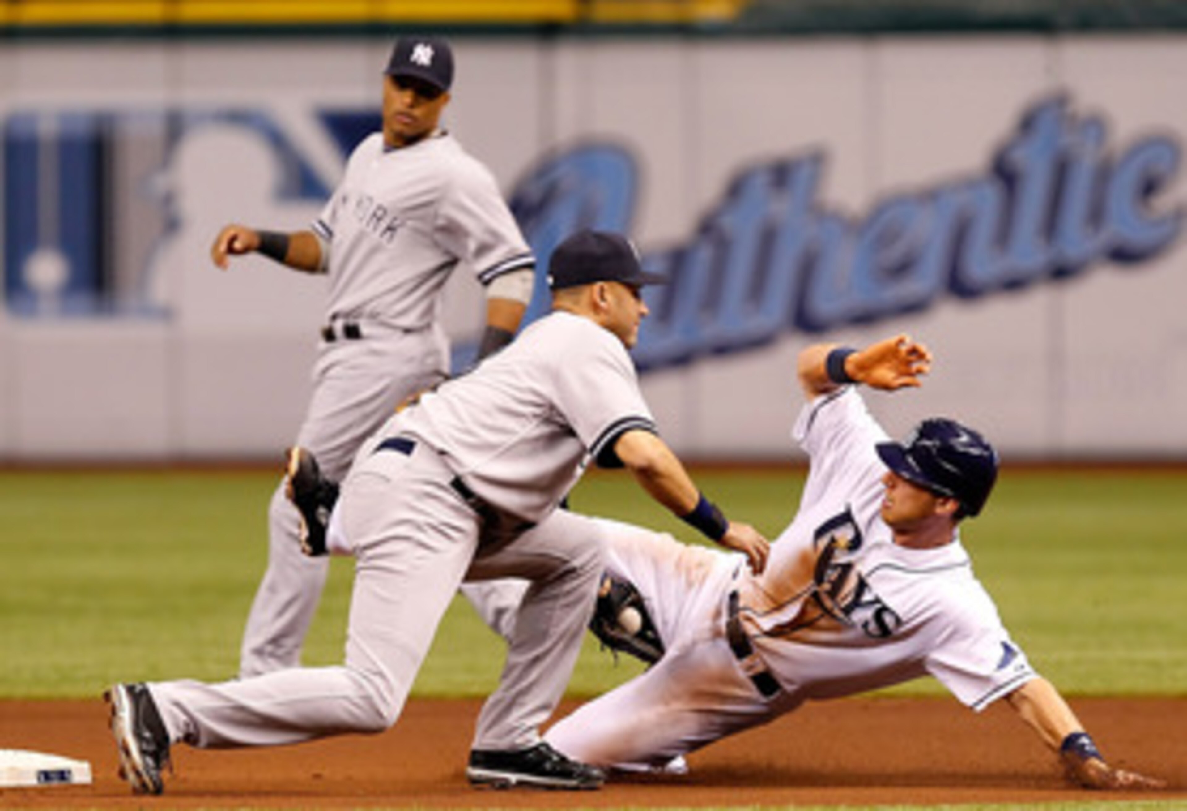 ST. PETERSBURG, FL - MAY 16:  Shortstop Derek Jeter #2 of the New York Yankees applies the tag to Ben Zobrist #18 of the Tampa Bay Rays as he attempts to steal second during the game at Tropicana Field on May 16, 2011 in St. Petersburg, Florida.  (Photo b