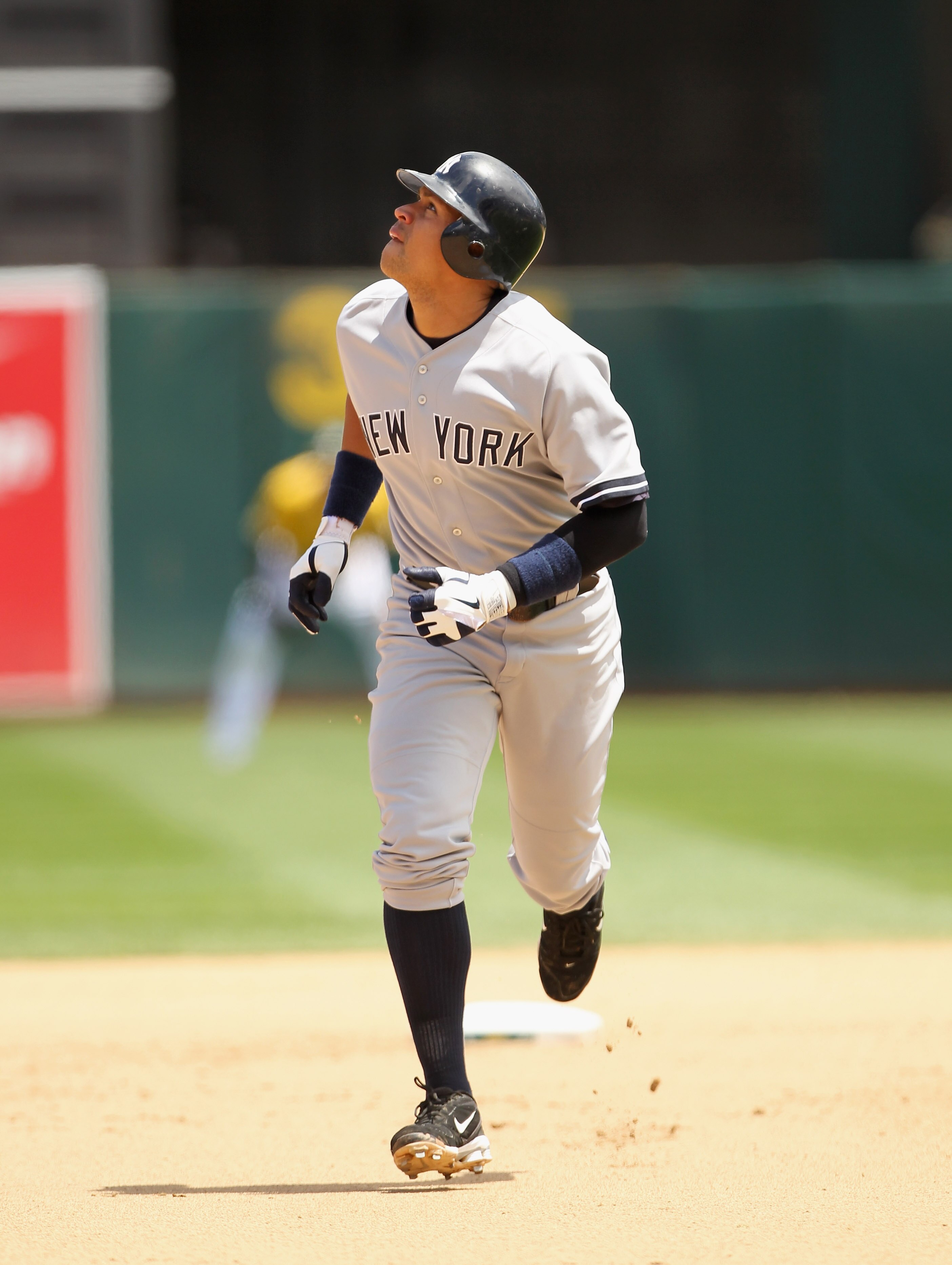 OAKLAND, CA - JUNE 01:  Alex Rodriguez #13 of the New York Yankees watches Nick Swisher's three run home run against the Oakland Athletics go over the wall at Oakland-Alameda County Coliseum on June 1, 2011 in Oakland, California.  (Photo by Ezra Shaw/Get
