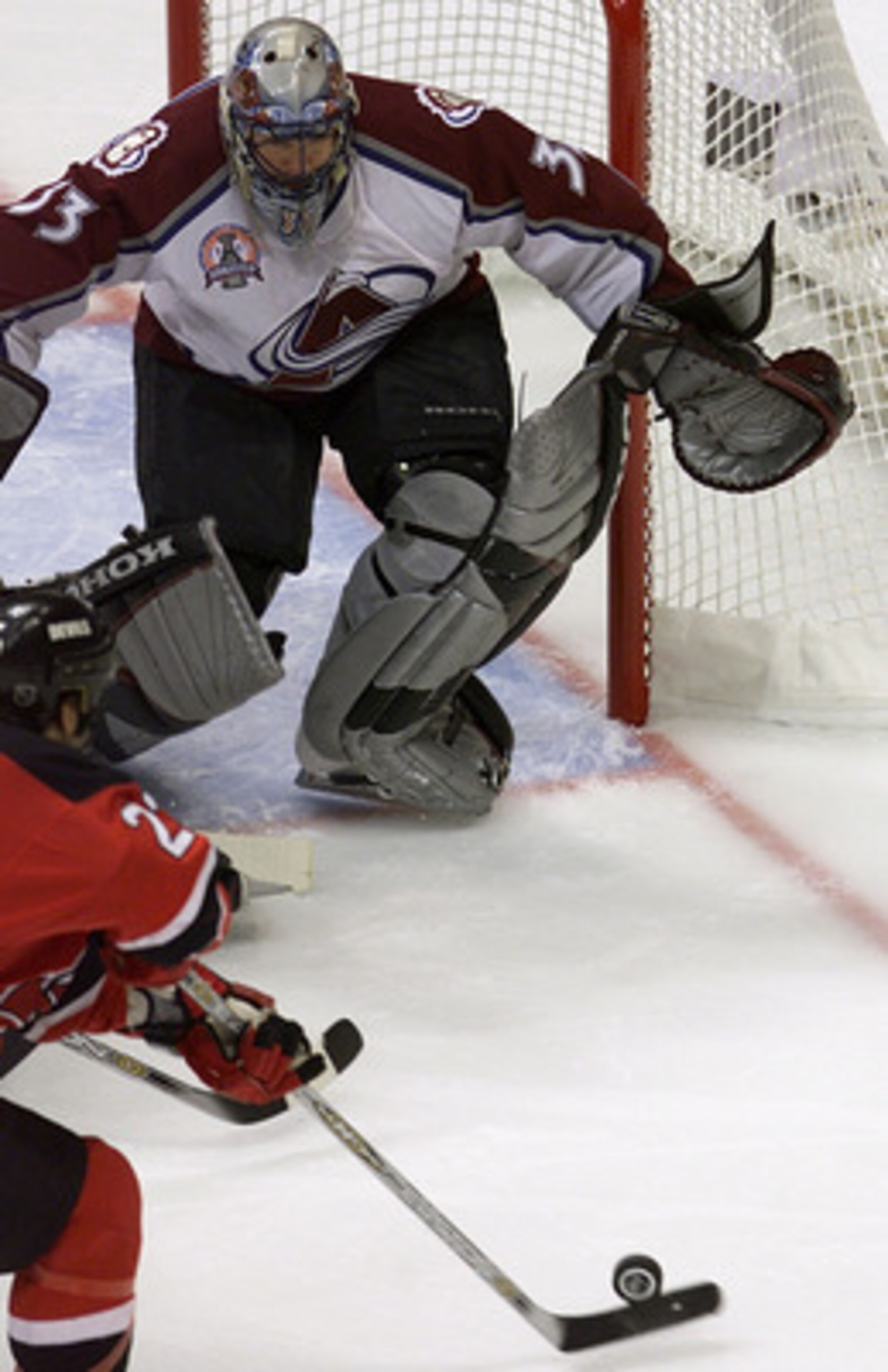 9 Jun 2001:   Goalie Patrick Roy #33 of the Colorado Avalanche prepares to make a save against Scott Gomez #23 of the New Jersey Devils during Game 7 of the Stanley Cup Finals at the Pepsi Center in Denver, Colorado.  The Avalanche won 3-1 to take the Sta
