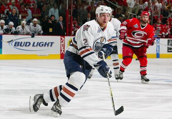RALEIGH, NC - JUNE 19:  Matt Greene #2 of the Edmonton Oilers skates against the Carolina Hurricanes during game seven of the 2006 NHL Stanley Cup Finals on June 19, 2006 at the RBC Center in Raleigh, North Carolina. The Hurricanes defeated the Oilers 3-1