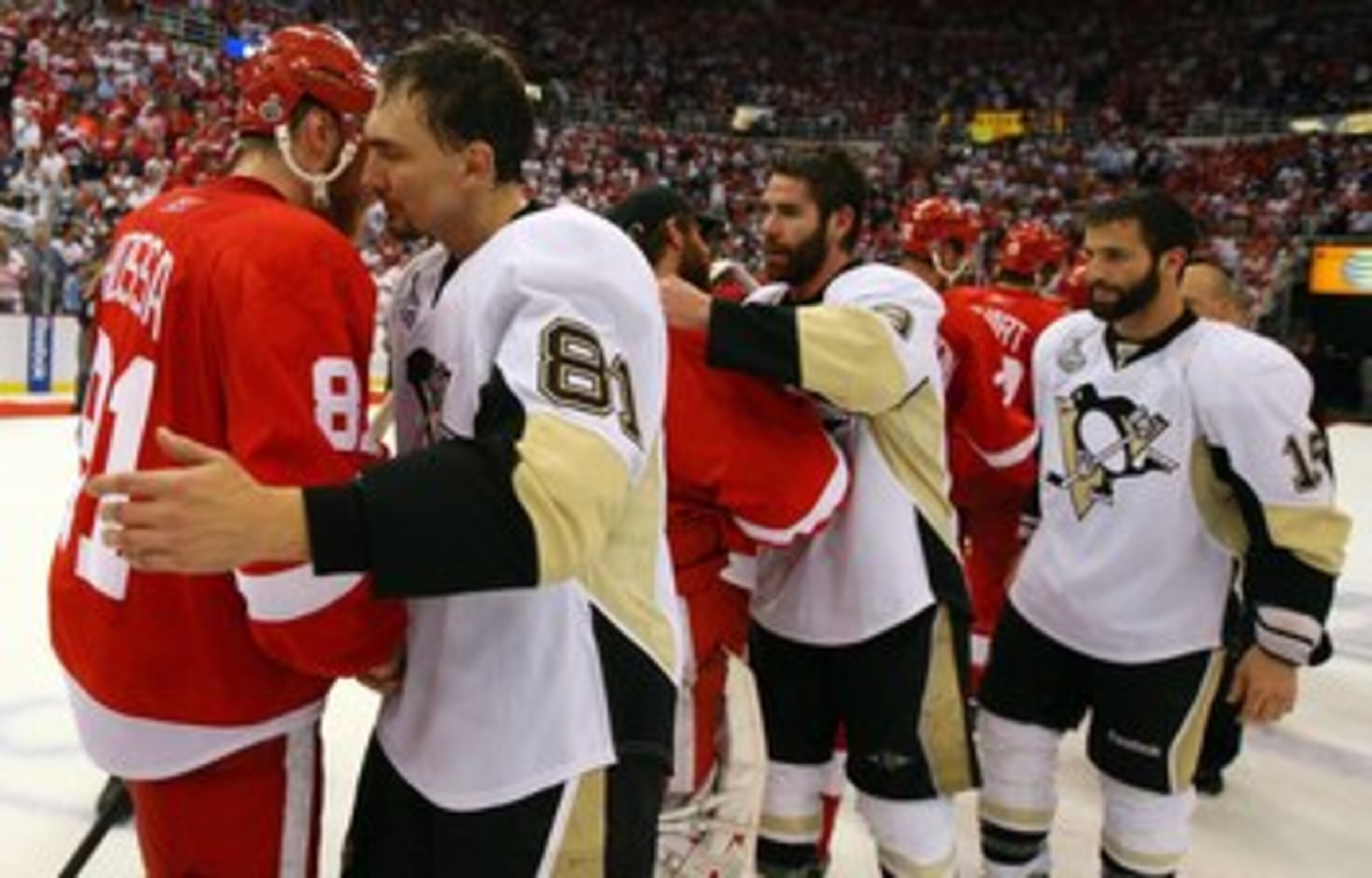 DETROIT - JUNE 12:  Miroslav Satan #81 of the Pittsburgh Penguins shakes hands with Marian Hossa #81 of the Detroit Red Wings after Game Seven of the 2009 NHL Stanley Cup Finals at Joe Louis Arena on June 12, 2009 in Detroit, Michigan.  (Photo by Jim McIs