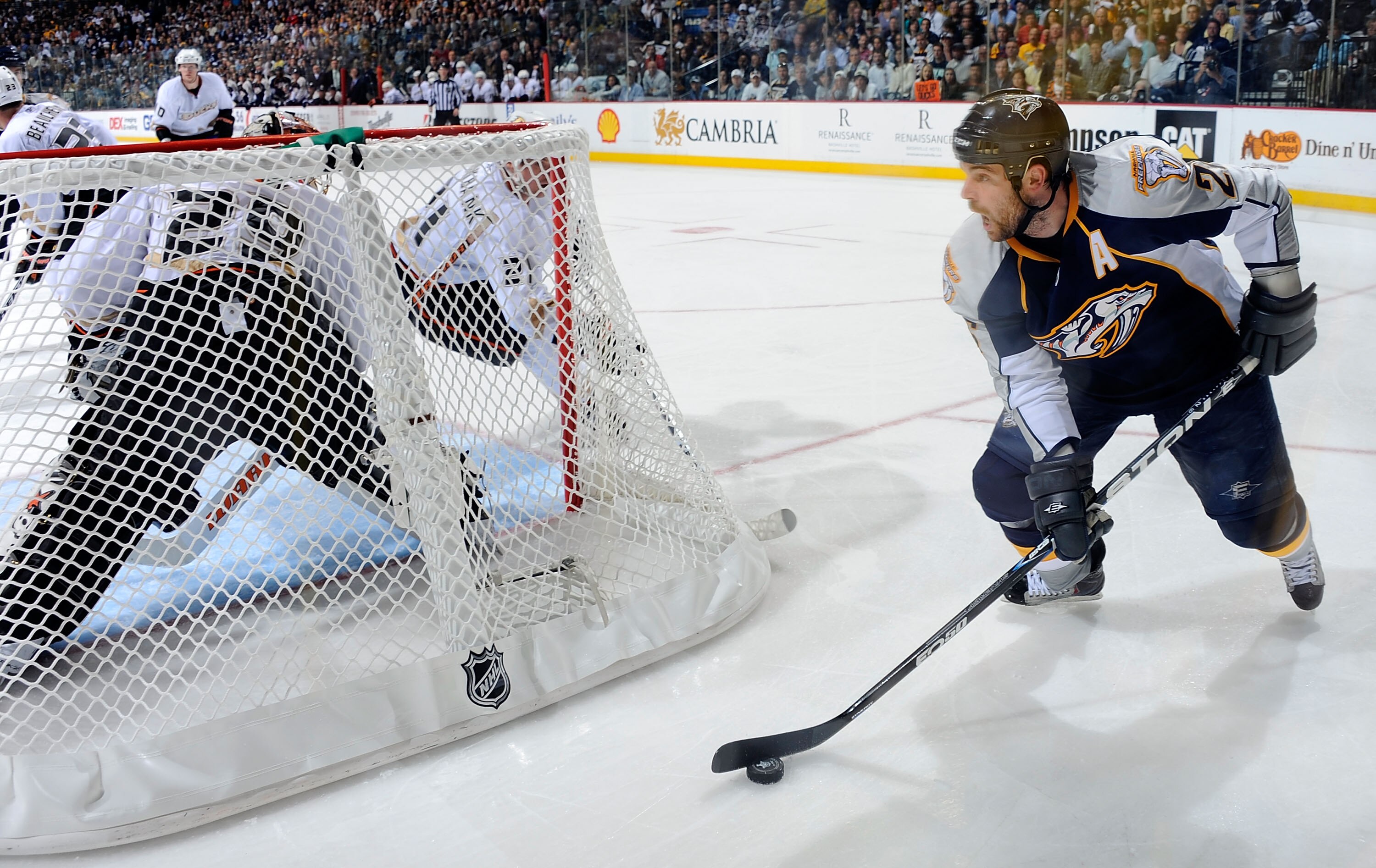 NASHVILLE, TN - APRIL 17:   Steve Sullivan #26 of the Nashville Predators carries the puck behind goalie Ray Emery #29 of the Anaheim Ducks in Game Three of the Western Conference Quarterfinals during the 2011 NHL Stanley Cup Playoffs at the Bridgestone A