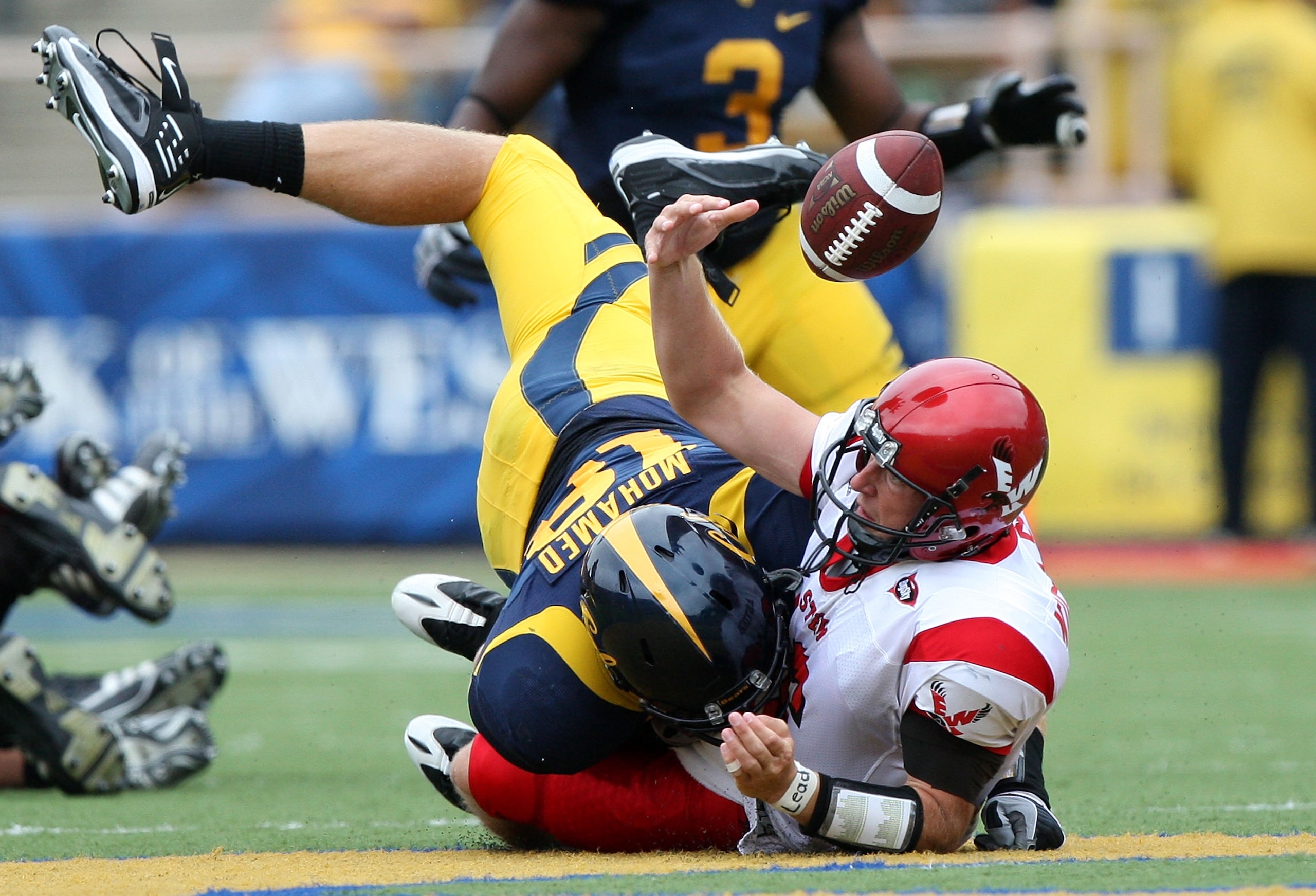 BERKELEY, CA - SEPTEMBER 12:  Mike Mohamed #18 of the California Golden Bears sacks Matt Nichols #16 of the Eastern Washington Eagles at Memorial Stadium on September 12, 2009 in Berkeley, California.  (Photo by Jed Jacobsohn/Getty Images)