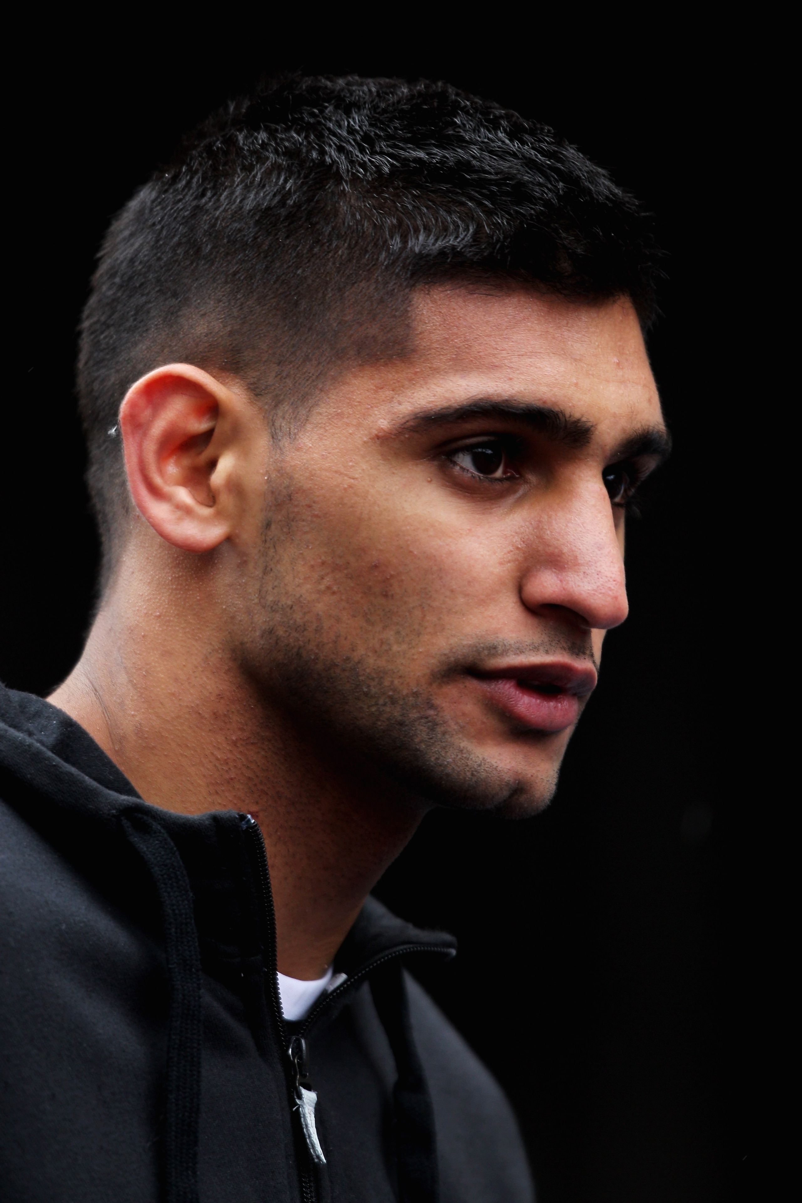 MANCHESTER, ENGLAND - MAY 15:  Boxer, Amir Khan of England looks on prior to being the Official Starter for the BUPA Great Manchester Run on May 15, 2011 in Manchester, England.  (Photo by Dean Mouhtaropoulos/Getty Images)