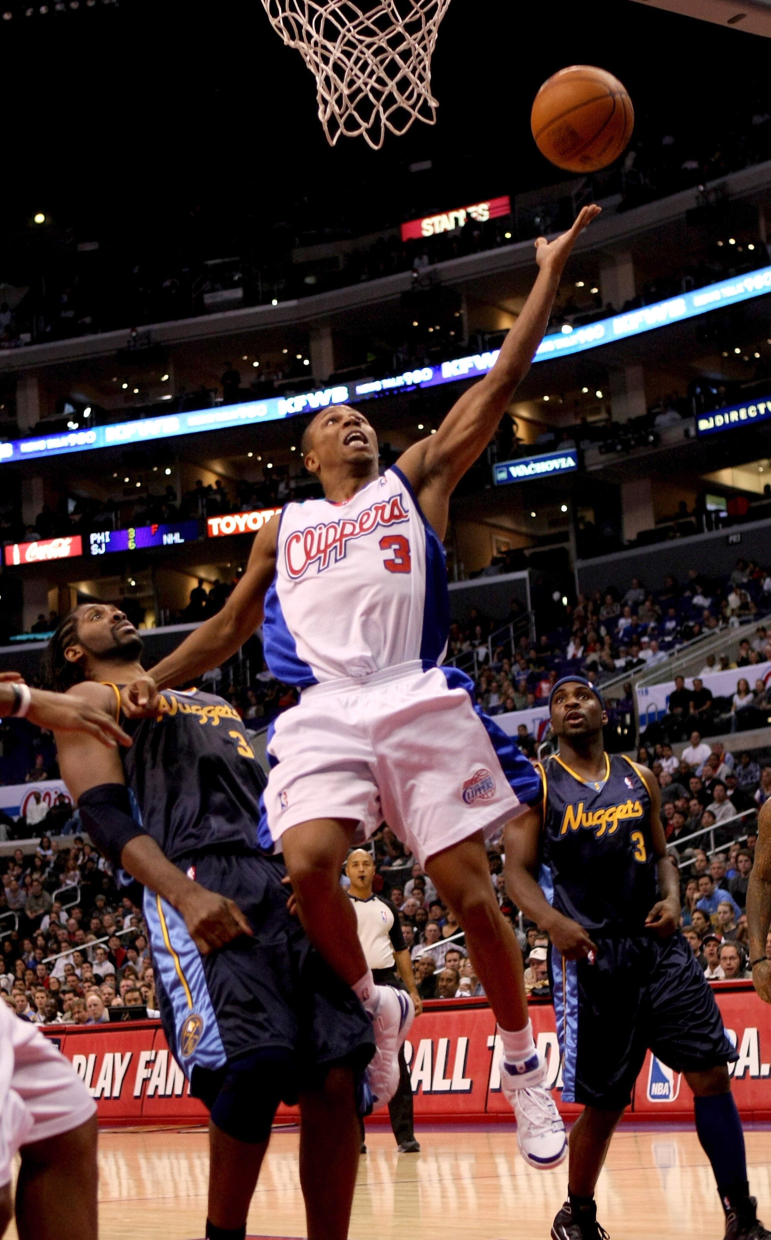 LOS ANGELES - NOVEMBER 20:  Sebastian Telfair #3 of the Los Angeles Clippers shoots over Nene #31 of the Denver Nuggets on November 20, 2009 at Staples Center in Los Angeles, California.  The Clippers won 106-99.    NOTE TO USER: User expressly acknowledg