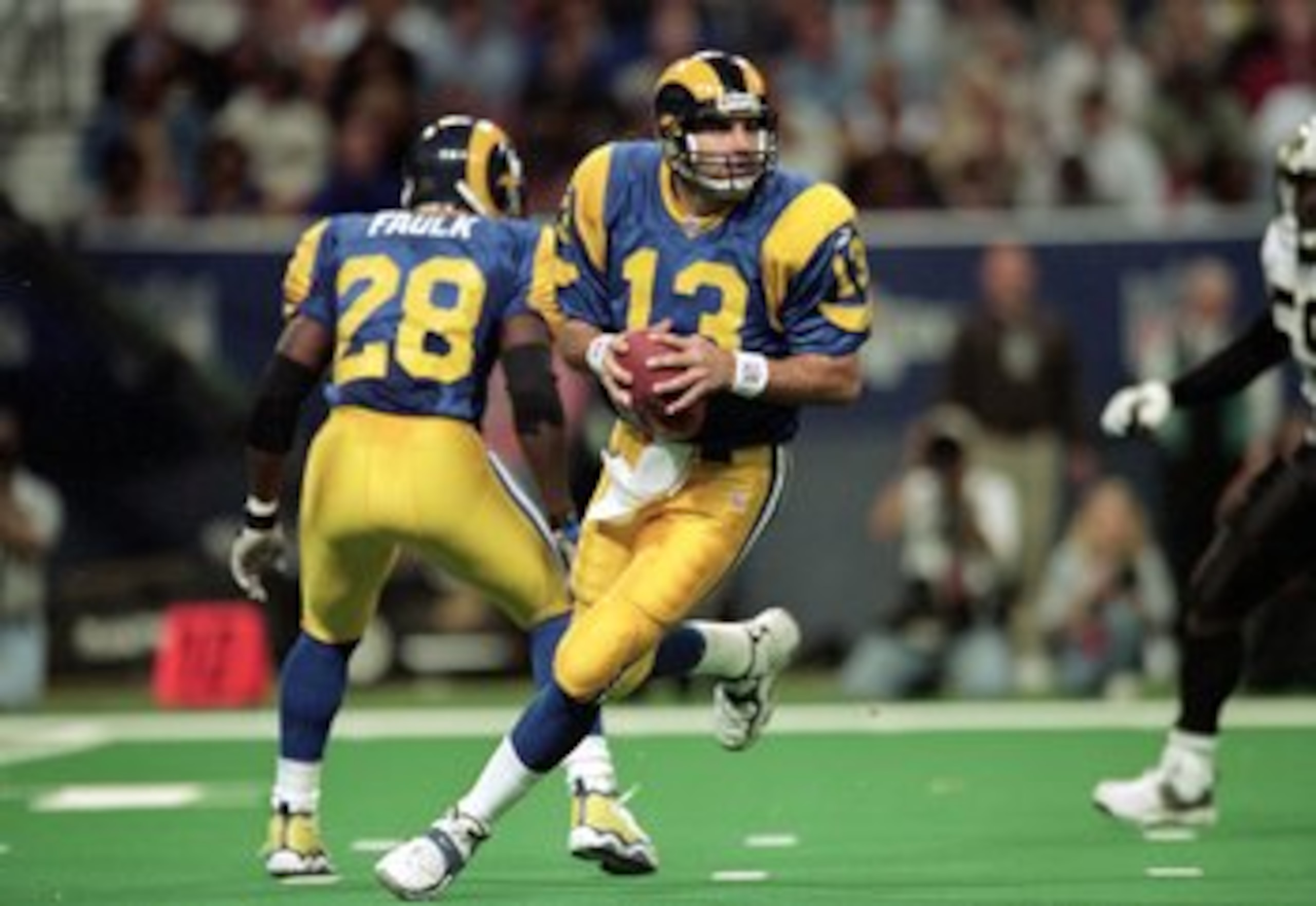 28 Nov 1999: Kurt Warner #13 of the St. Louis Rams runs to pass the ball during a game against the New Orleans Saints at the Trans World Dome in St. Louis, Missouri. The Rams defeated the Saints 43-12. Mandatory Credit: Elsa Hasch  /Allsport