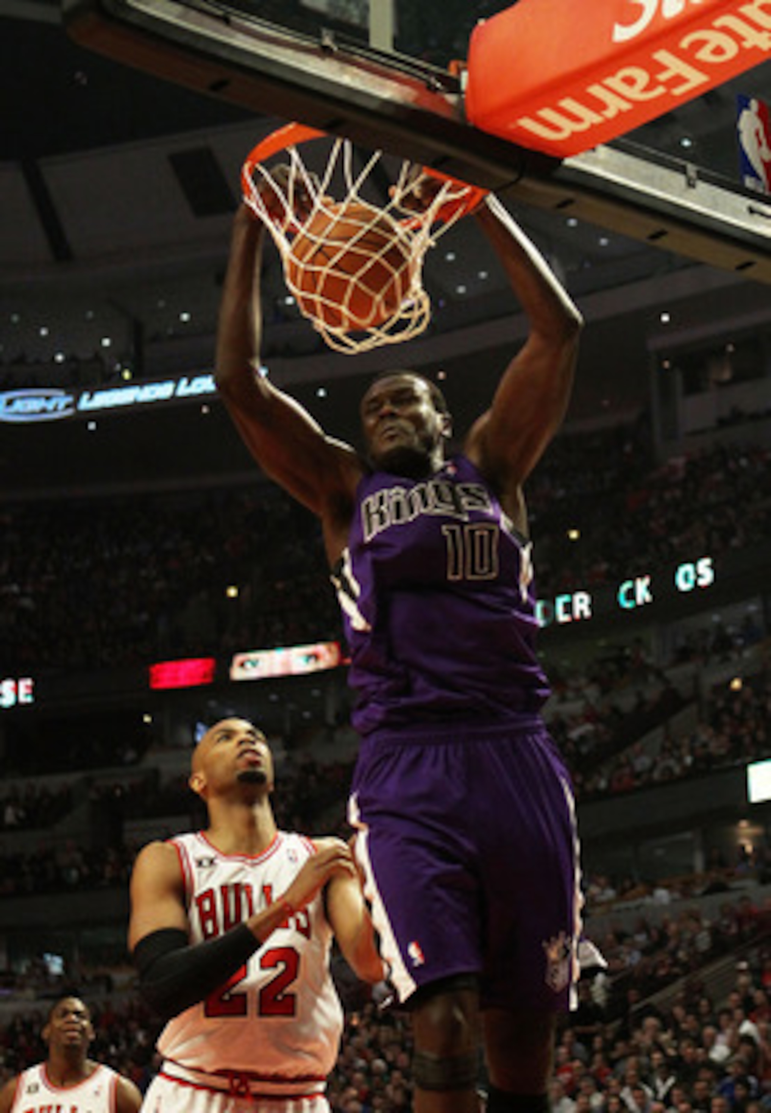 CHICAGO, IL - MARCH 21: Samuel Dalembert #10 of the Sacramento Kings dunks the ball over Taj Gibson #22 of the Chicago Bulls at the United Center on March 21, 2011 in Chicago, Illinois. The Bulls defeated the Kings 132-92. NOTE TO USER: User expressly ack