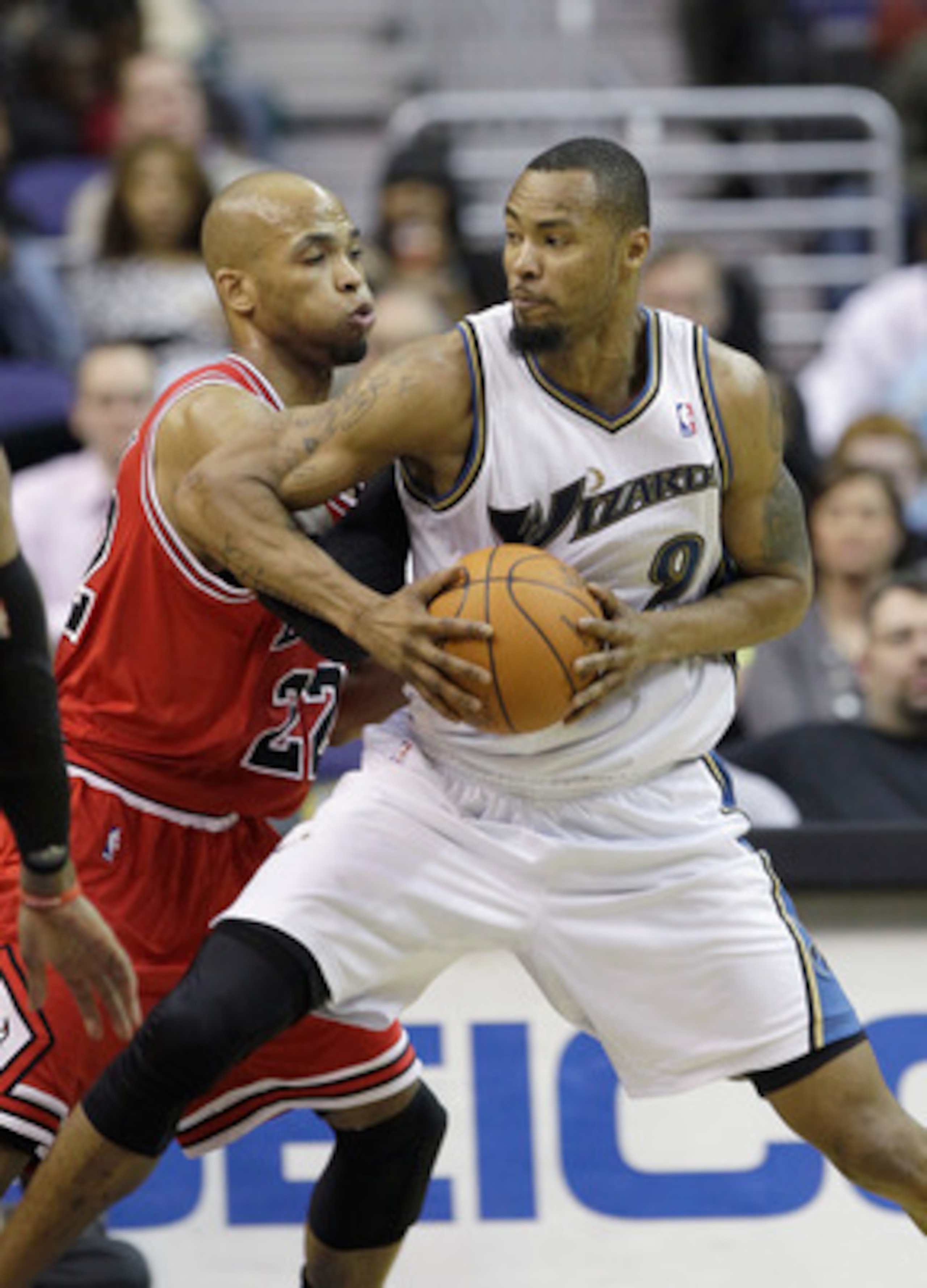 WASHINGTON, DC - FEBRUARY 28: Taj Gibson #22 of the Chicago Bulls guards Rashard Lewis #9 of the Washington Wizards at the Verizon Center in Washington on February 28, 2011 in Washington, DC. NOTE TO USER: User expressly acknowledges and agrees that, by d