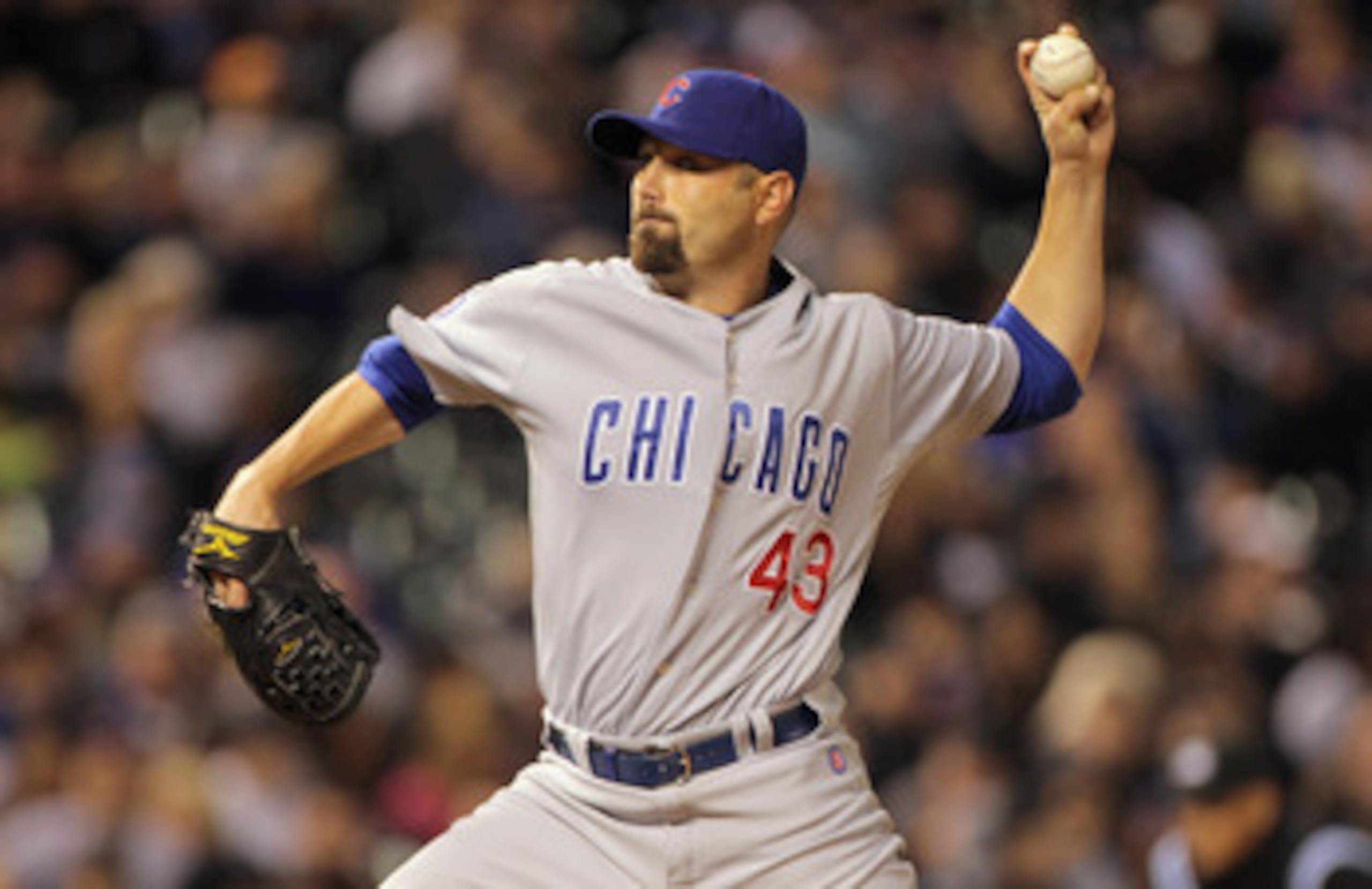 DENVER, CO - APRIL 16:  Relief pitcher John Grabow #43 of the Chicago Cubs delivers against the Colorado Rockies at Coors Field on April 16, 2011 in Denver, Colorado.  (Photo by Doug Pensinger/Getty Images)