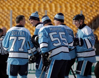 PITTSBURGH, PA - DECEMBER 31:  Ron Francis #10 of the Pittsburgh Penguins celebrates his goal with teammates Paul Coffey #77, Larry Murphy #55, Kevin Stevens #25 and Mario Lemieux #66 against the Washington Capitals during the 2011 NHL Winter Classic Alum
