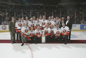 UNIONDALE, NY - MARCH 4:  Memebers of the 1980 New York Islanders pose for a team photo during a ceremony honoring the 25th anniversary of the Islanders first Stanley Cup victory held on March 4, 2006 at the Nassau Coliseum in Uniondale, New York.  (Photo