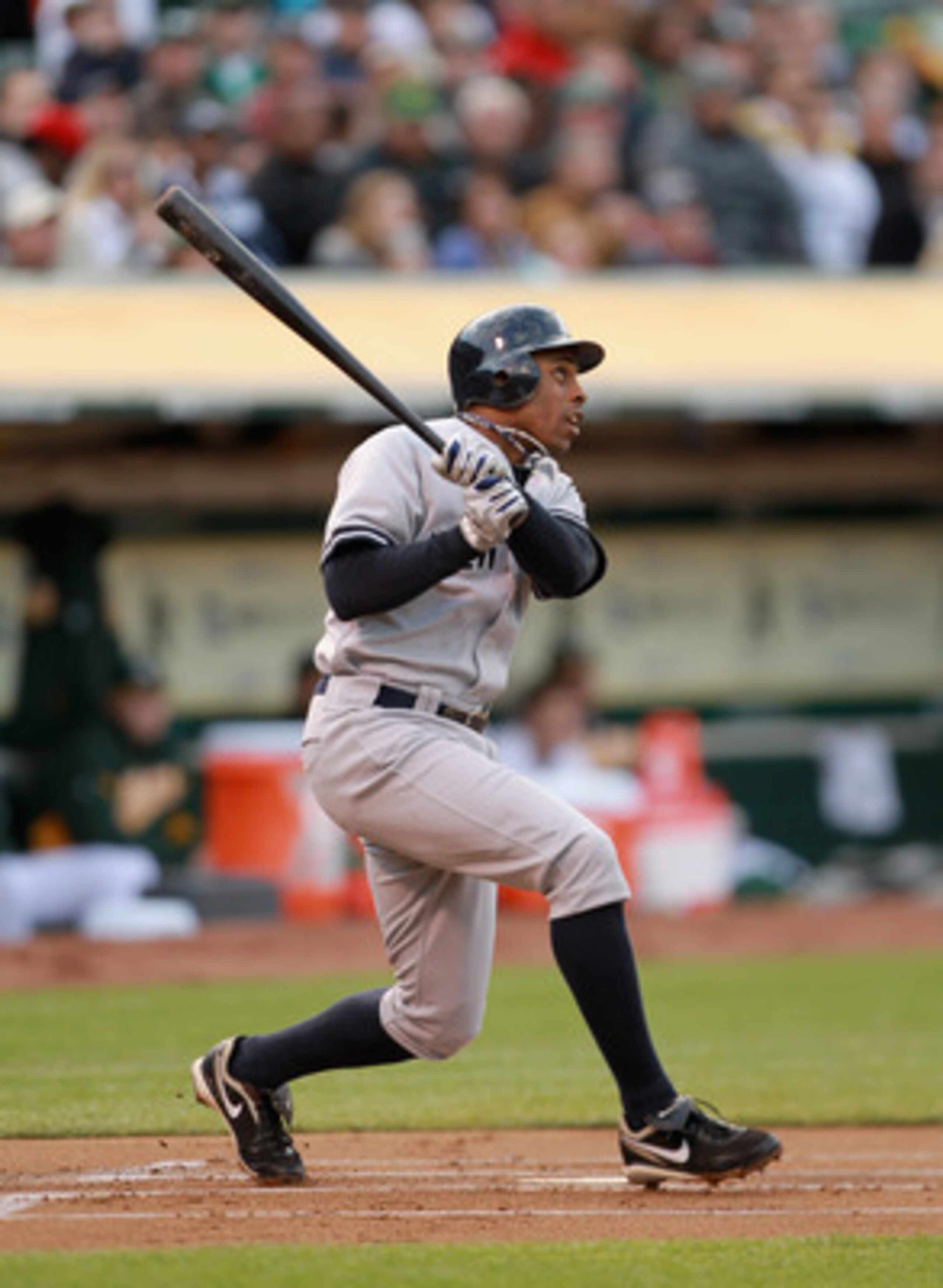 OAKLAND, CA - MAY 31:  Curtis Granderson #14 of the New York Yankees hits a two run home run in the first inning against the Oakland Athletics at Oakland-Alameda County Coliseum on May 31, 2011 in Oakland, California.  (Photo by Ezra Shaw/Getty Images)