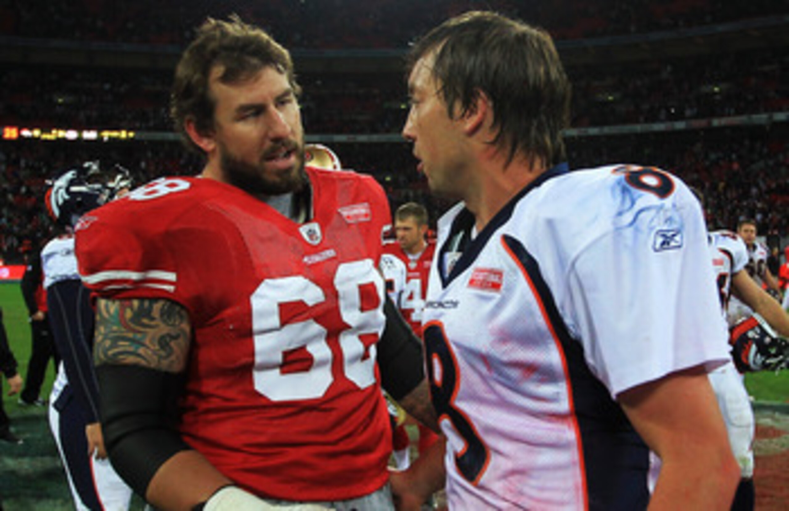 LONDON, ENGLAND - OCTOBER 31:  Quarterback Kyle Orton #8 of Denver Broncos and Adam Snyder #68 of San Francisco 49ers talk after the NFL International Series match between Denver Broncos and San Francisco 49ers at Wembley Stadium on October 31, 2010 in Lo