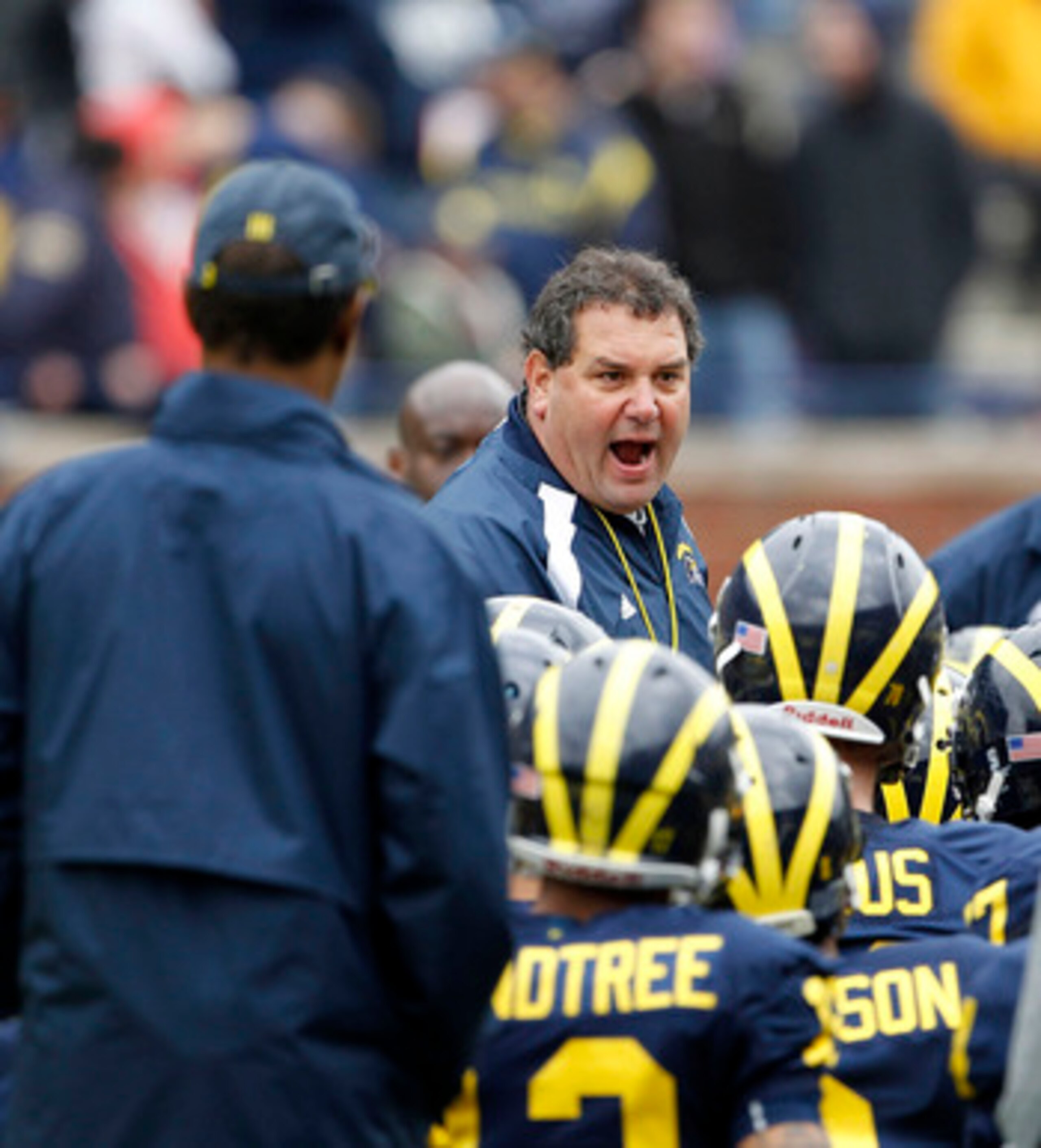ANN ARBOR, MI - APRIL 16:  Head football coach Brady Hoke talks with his team during the annual Spring Game at Michigan Stadium on April 16, 2011 in Ann Arbor, Michigan.  (Photo by Leon Halip/Getty Images)