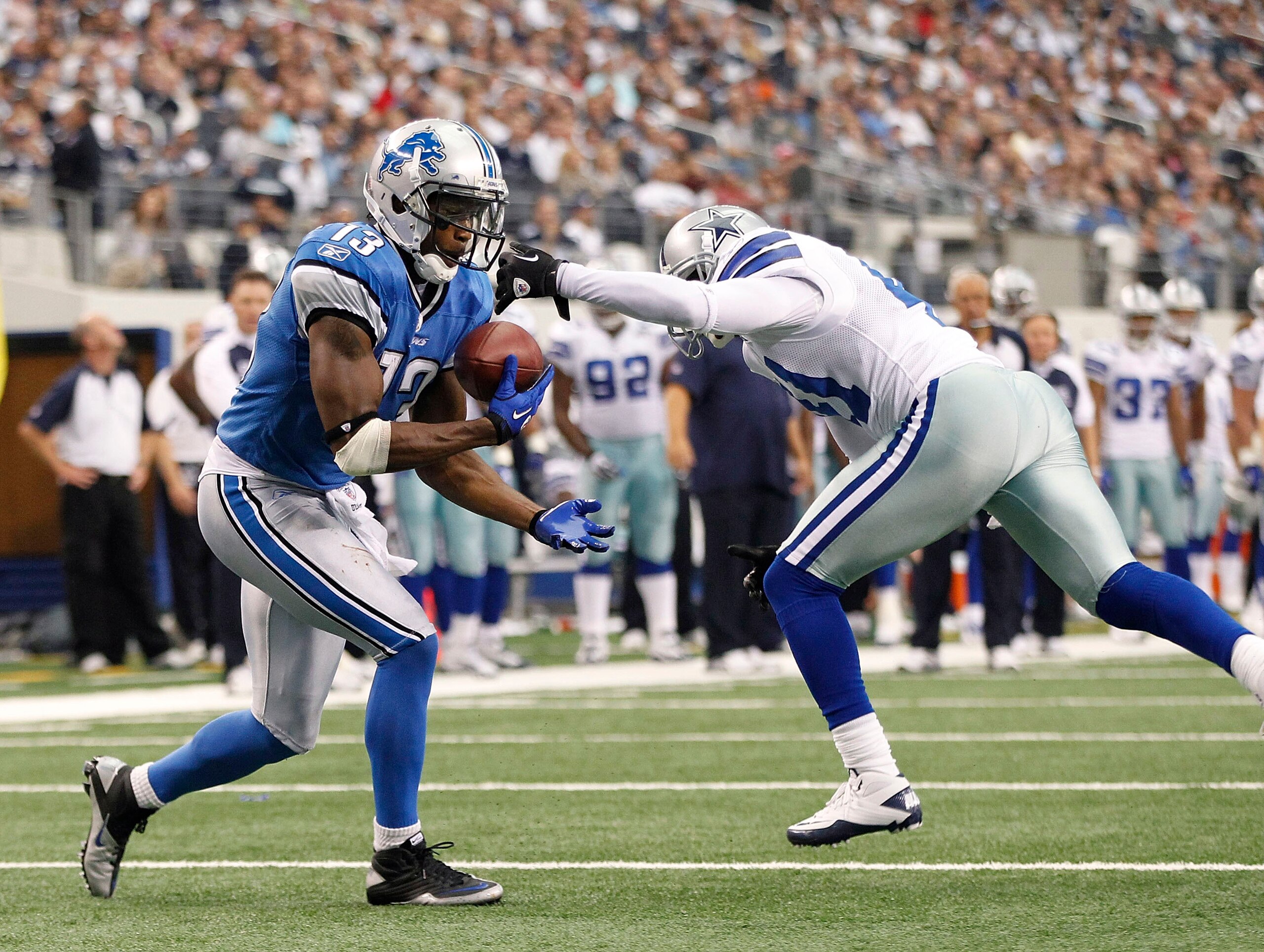 ARLINGTON, TX - NOVEMBER 21: Nate Burleson #13 of the Detroit Lions scores a late second quarter touchdown as Terence Newman #41 of the Dallas Cowboys defends at Dallas Stadium on November 21, 2010 in Arlington, Texas. (Photo by Leon Halip/Getty Images) ARLINGTON, TX - NOVEMBER 21: Nate Burleson #13 of the Detroit Lions scores a late second quarter touchdown as Terence Newman #41 of the Dallas Cowboys defends at Dallas Stadium on November 21, 2010 in Arlington, Texas. (Photo by Leon Halip/Getty Images)