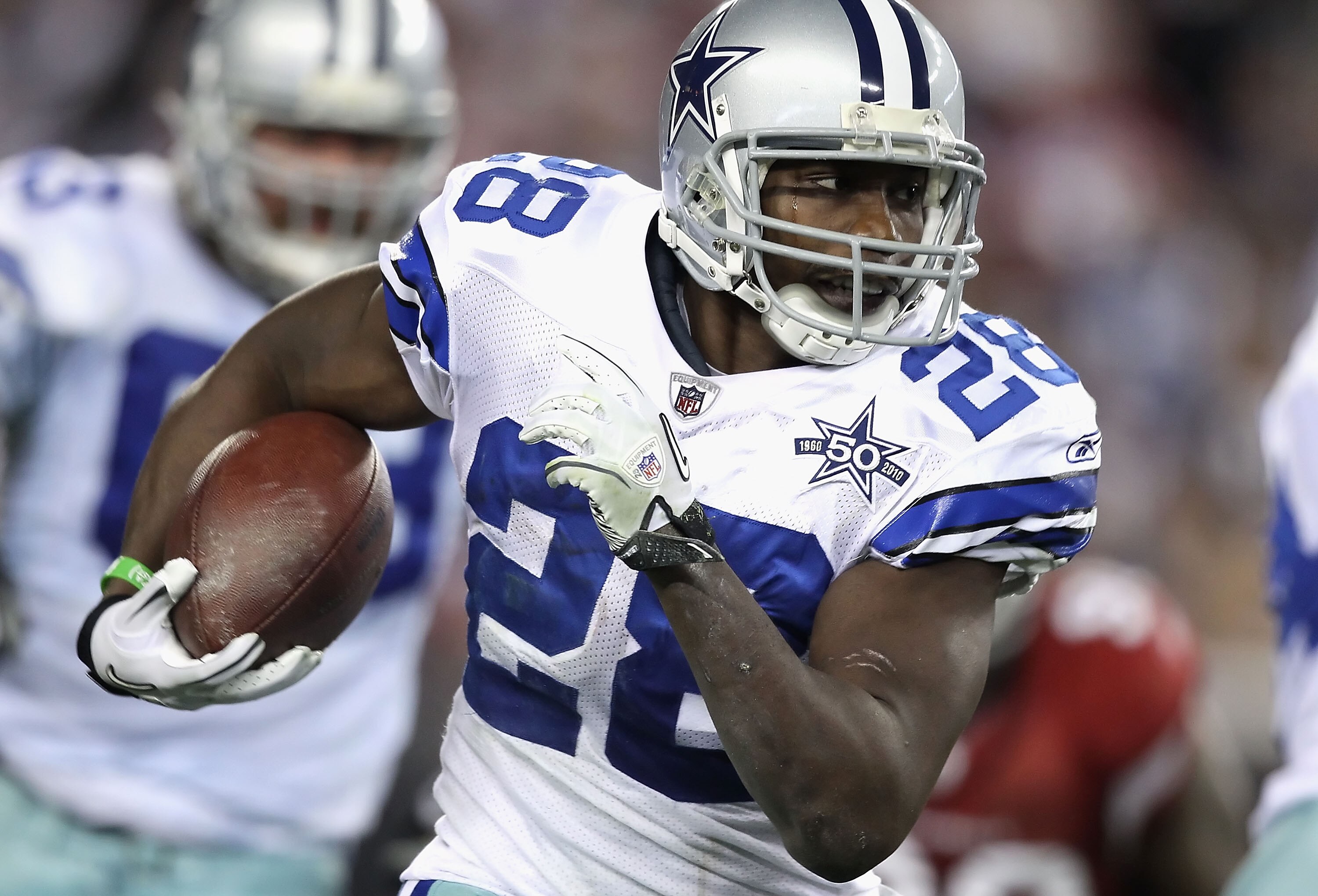 GLENDALE, AZ - DECEMBER 25:  Runningback Felix Jones #28 of the Dallas Cowboys rushes the football during the NFL game against the Arizona Cardinals at the University of Phoenix Stadium on December 25, 2010 in Glendale, Arizona.  The Cardinals defeated th