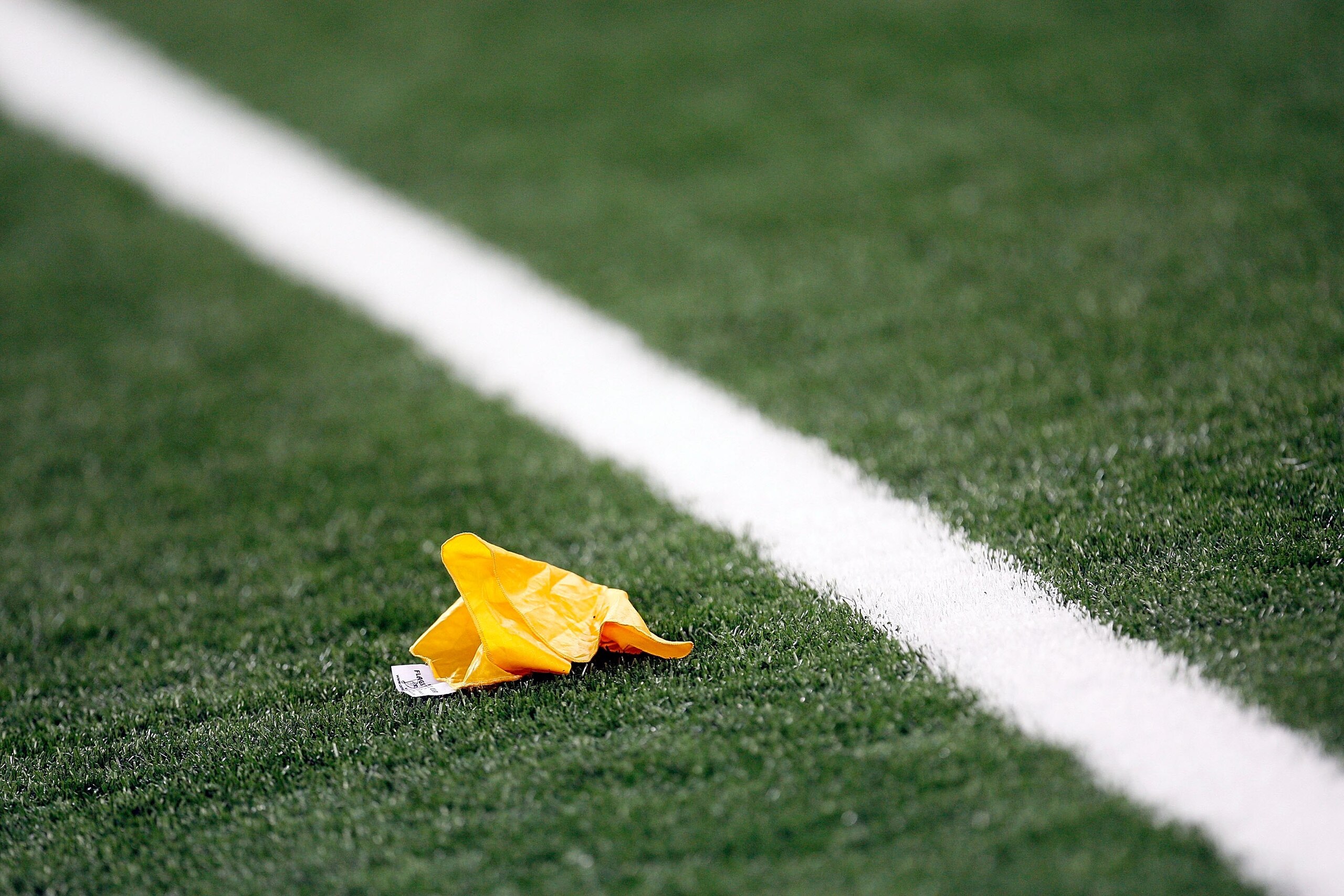 ARLINGTON, TX - SEPTEMBER 05: A yellow penalty flag during a game between the Brigham Young Cougars and the Oklahoma Sooners at Cowboys Stadium on September 5, 2009 in Arlington, Texas. (Photo by Ronald Martinez/Getty Images) ARLINGTON, TX - SEPTEMBER 05: A yellow penalty flag during a game between the Brigham Young Cougars and the Oklahoma Sooners at Cowboys Stadium on September 5, 2009 in Arlington, Texas. (Photo by Ronald Martinez/Getty Images)